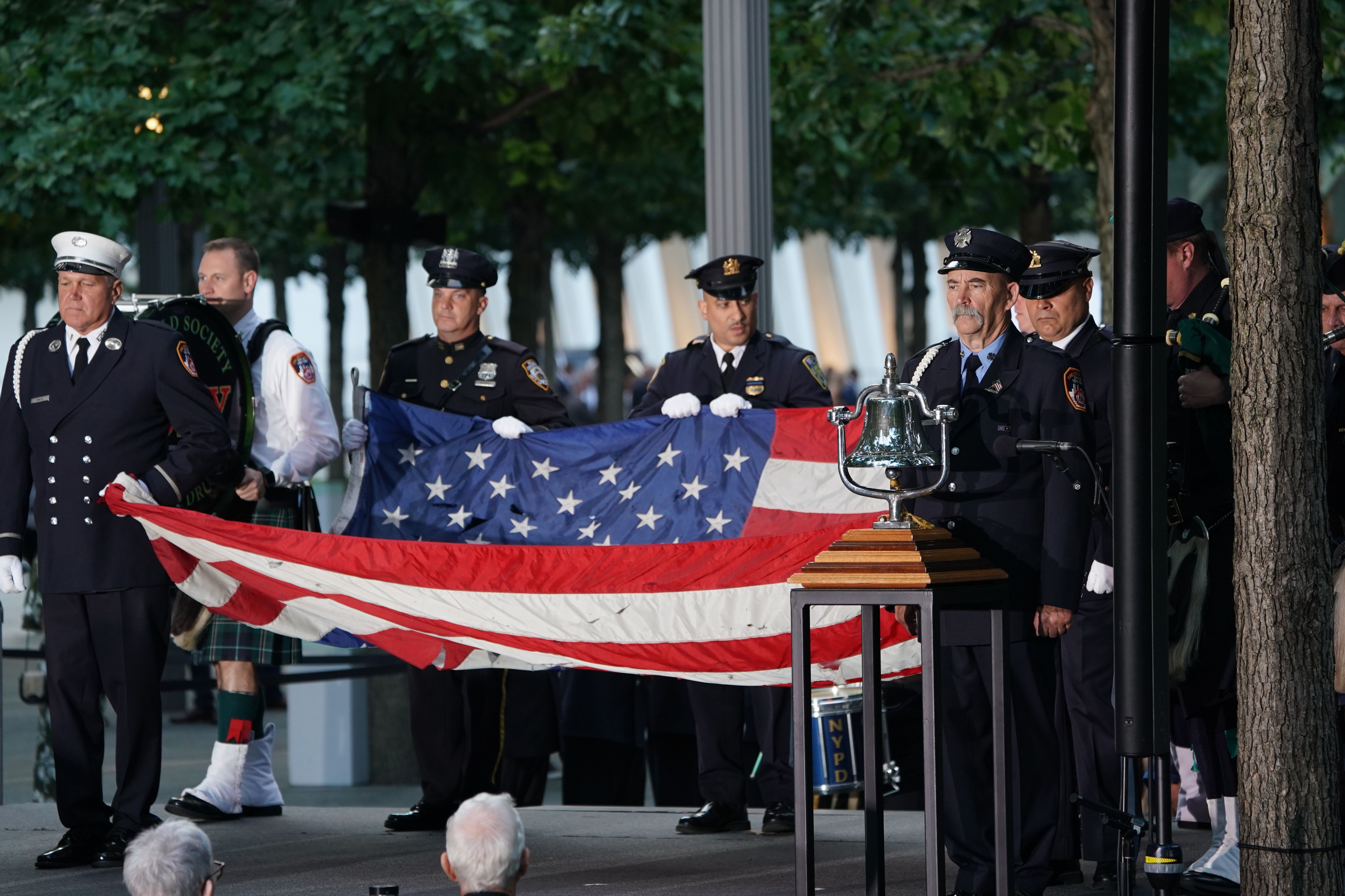 Flag bearers take part in the September 11 Commemoration Ceremony at the 9/11 Memorial at the World Trade Center