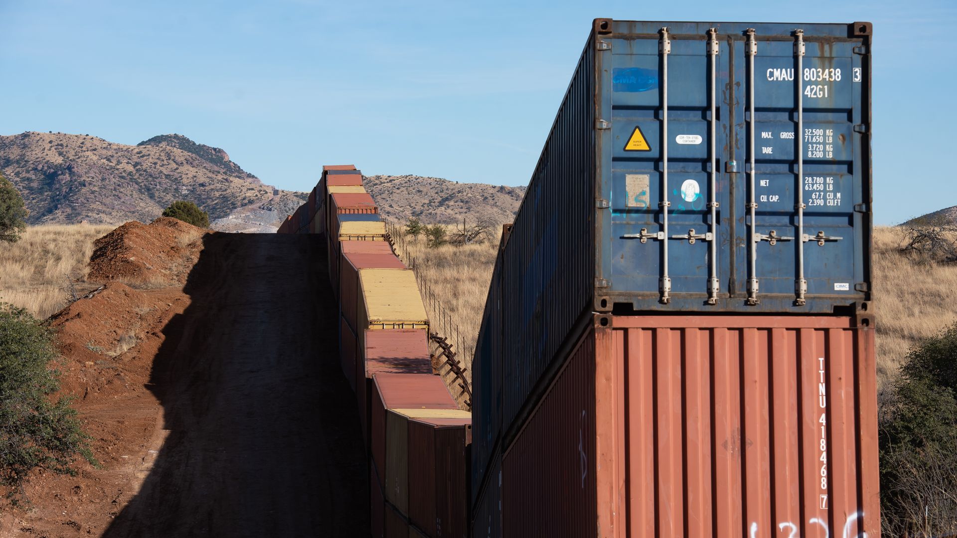 Photo of a wall made of colorful shipping containers