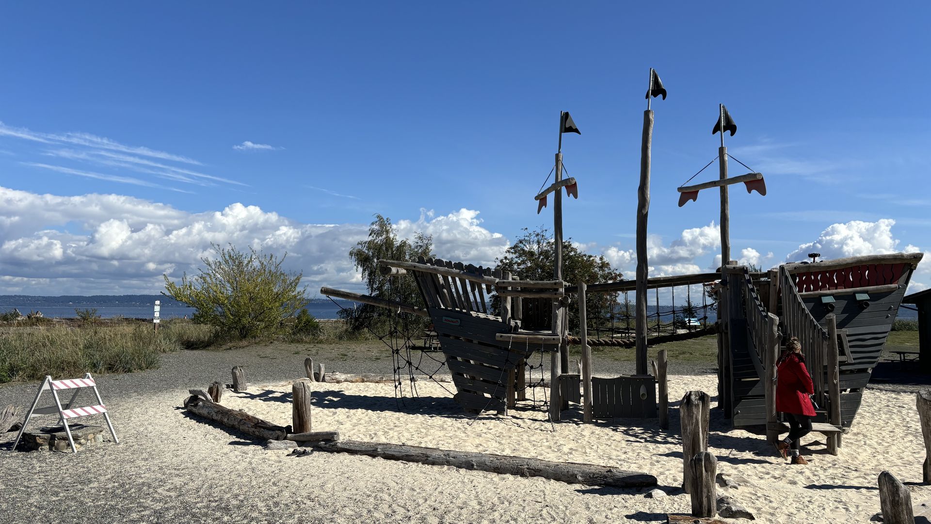 A children's playground made to look like the shell of a wooden boat on a Puget Sound island.