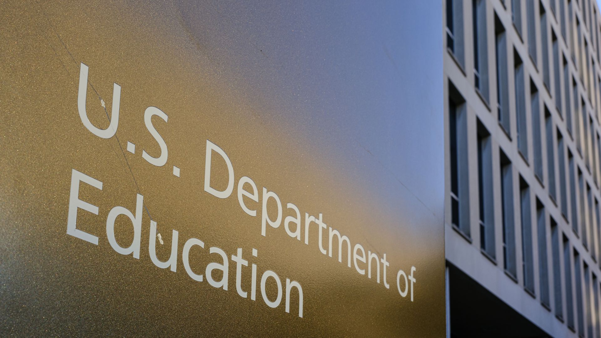 A sign reads "U.S. Department of Education" on the facade of a building 