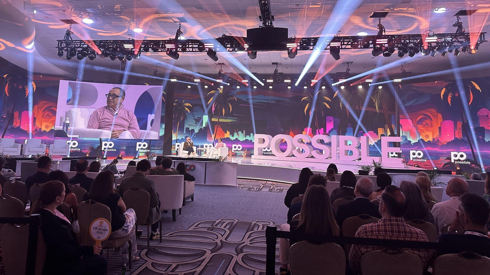 Forbes' Seth Matlins and MediaLink founder Michael Kassan onstage next to the word POSSIBLE