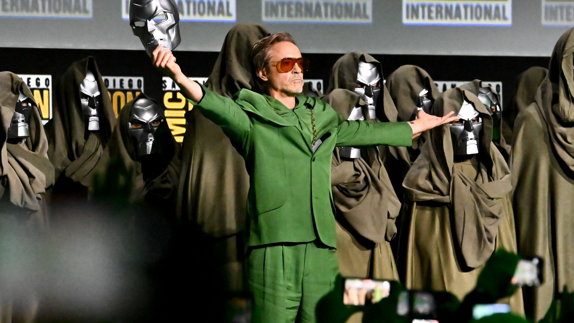 Robert downey Jr. revealing himself by taking off a Dr. Doom mask