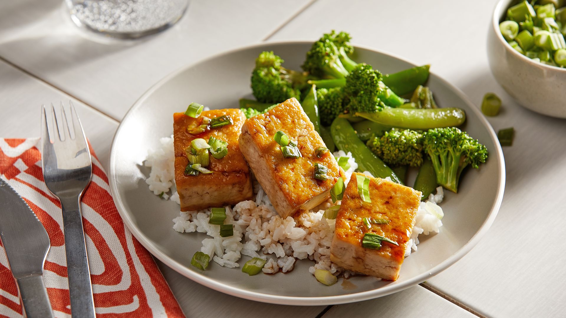 Honey Garlic Tofu with Sautéed Broccoli and Sugar Snap Peas.