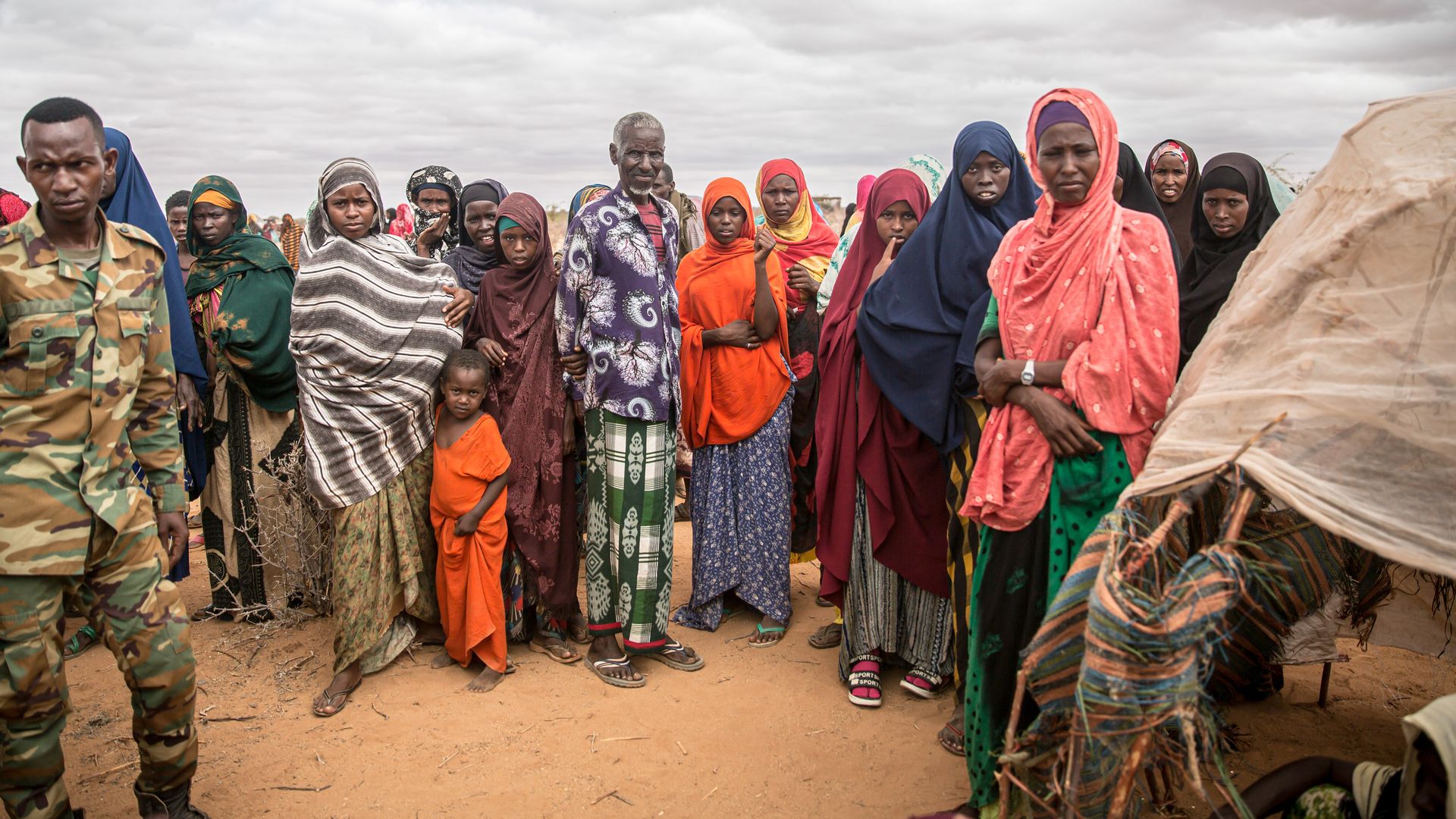 People displaced due to the drought wait for assistance in a camp on the outskirts of Dollow, Somalia. Photo: Sally Hayden/SOPA Images/LightRocket via Getty Images 