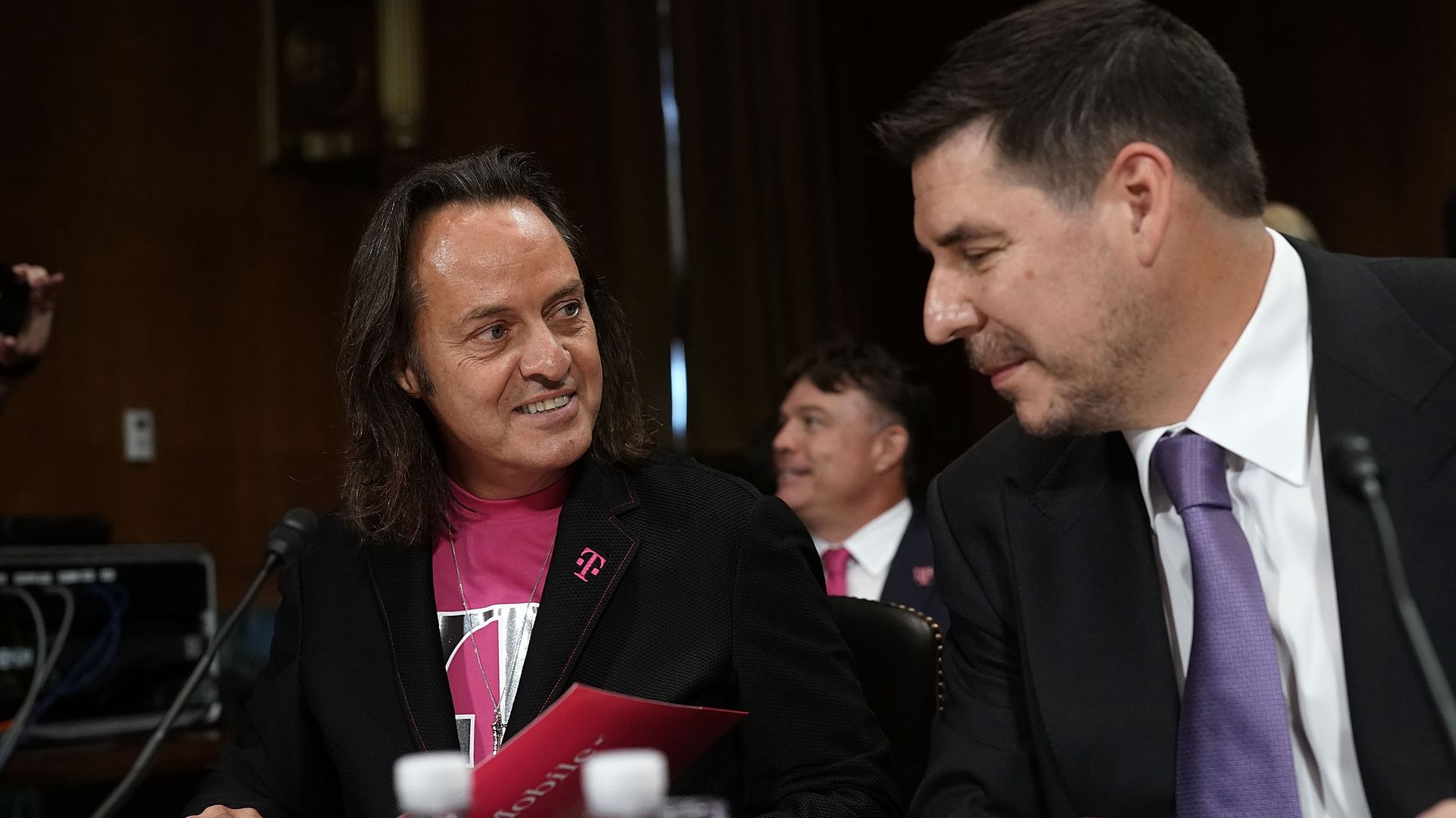 CEO of T-Mobile US Inc. John Legere (L) and Executive Chairman of Sprint Corporation Marcelo Claure (R) at a hearing before Congress