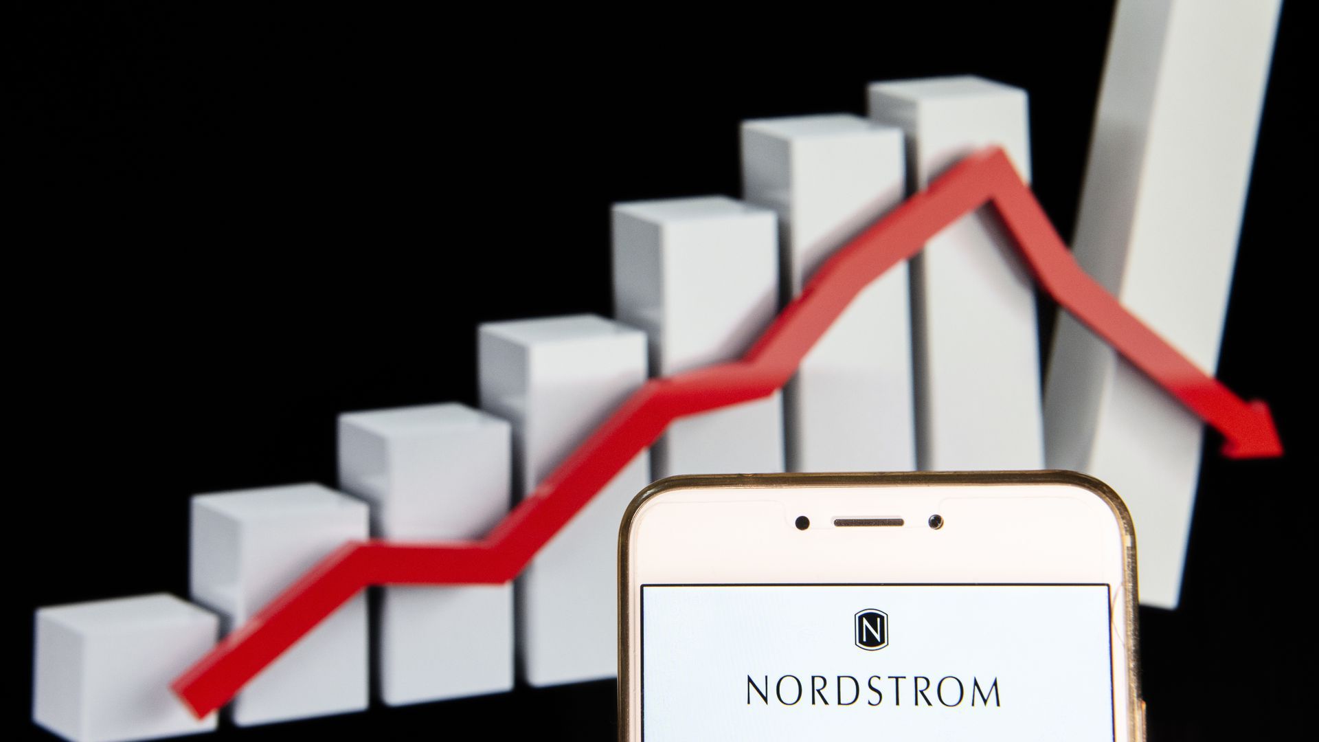 A bar graph with a phone that has Nordstom's logo on it