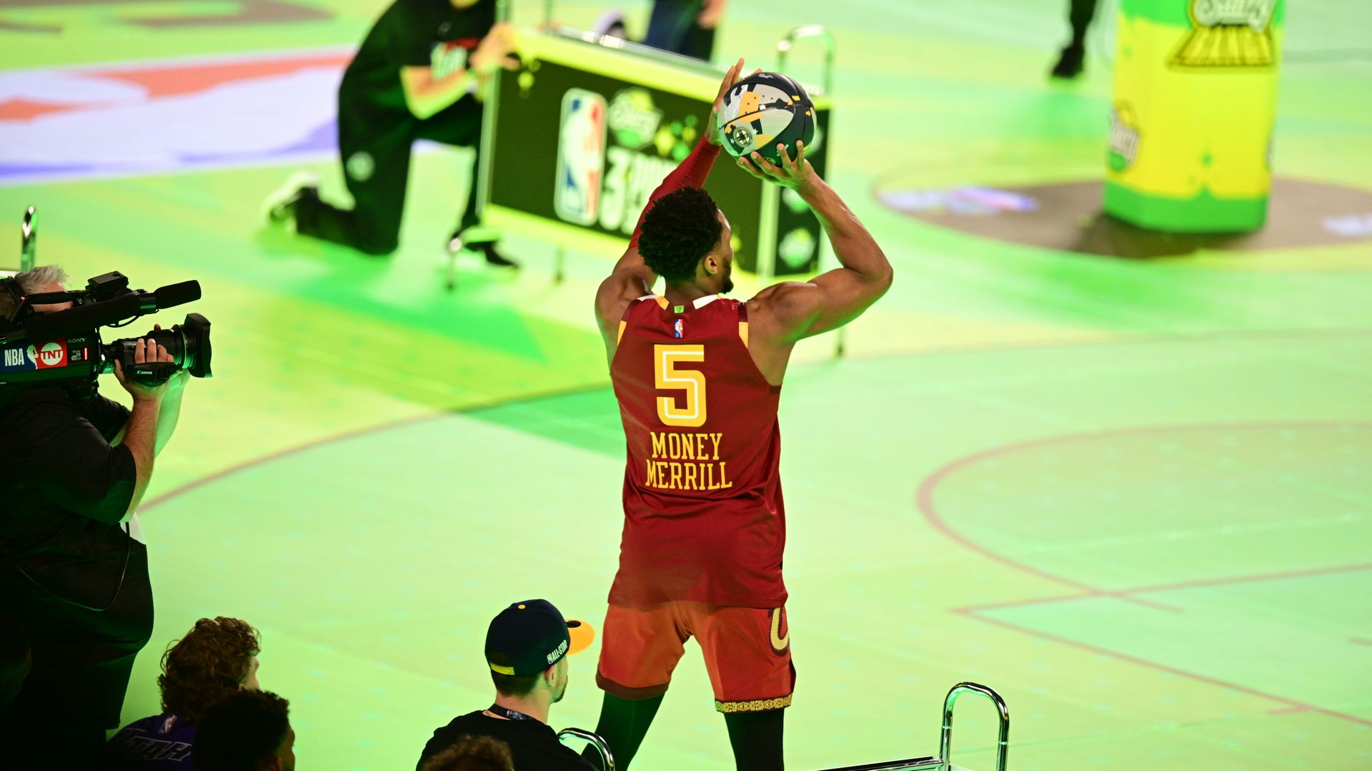 The Cavs' Donovan Mitchell in the 2024 NBA All-Star Game three-point contest, wearing a #5 jersey with the name "Money Merrill"