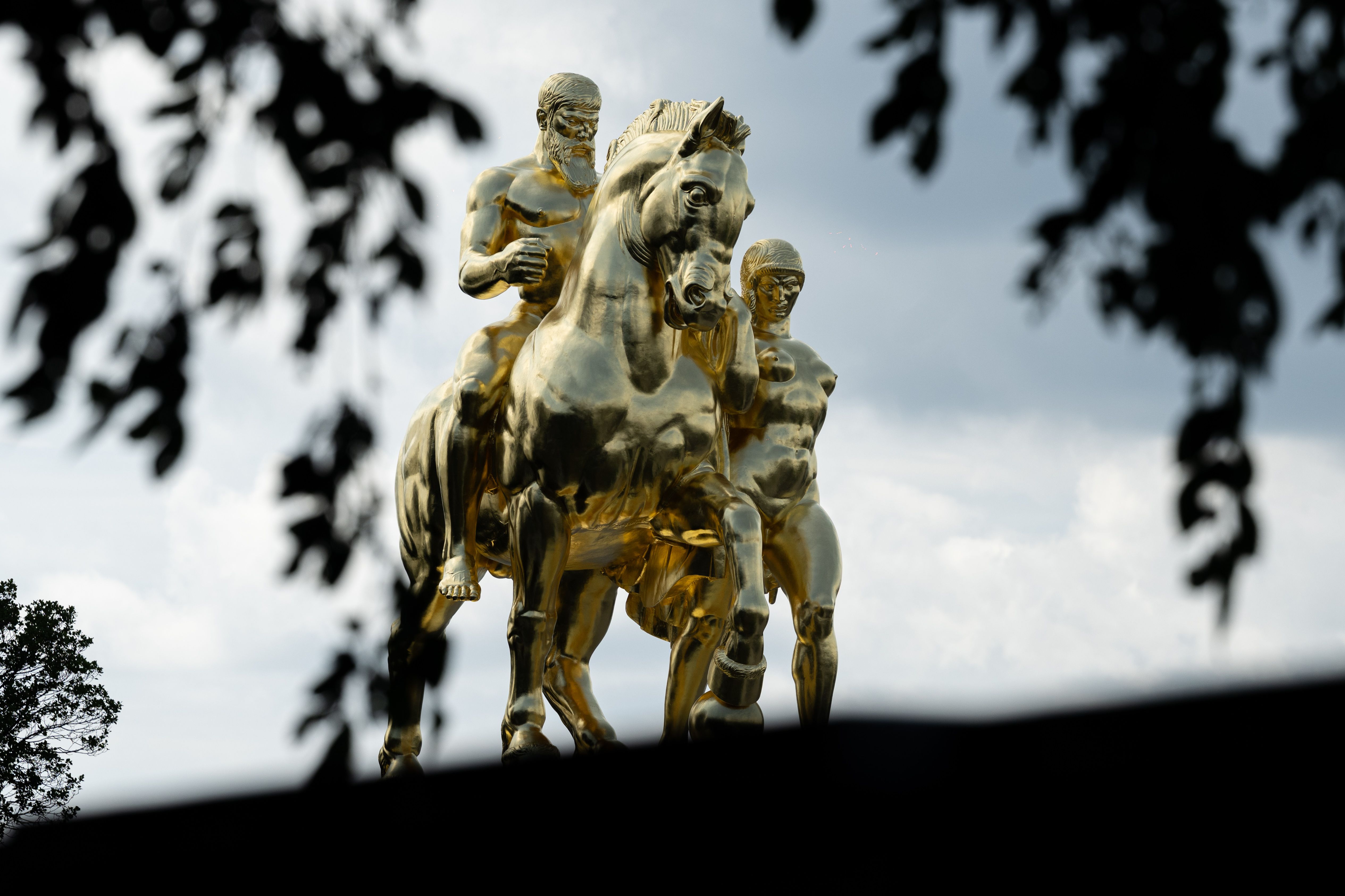 Equestrian statues covered in gold leaf at Arlington Memorial Bridge.