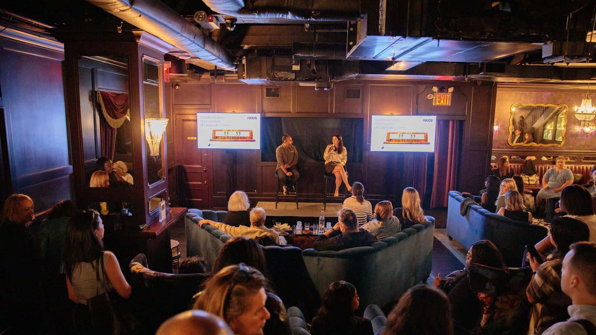 Eleanor Hawkins and Nishant Roy conversing on stage.