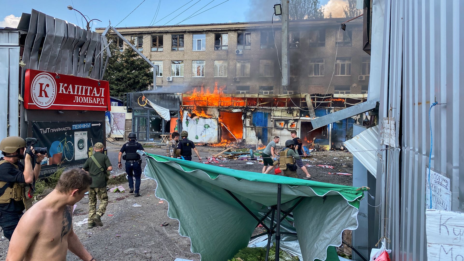 Firefighters extinguish out the fire in the market on September 6, 2023 in Kostiantynivka, Ukraine. At least 16 people have been killed and 31 more injured, after a rocket hit a market in Kostyantynivka, in Ukraine's eastern Donetsk region.