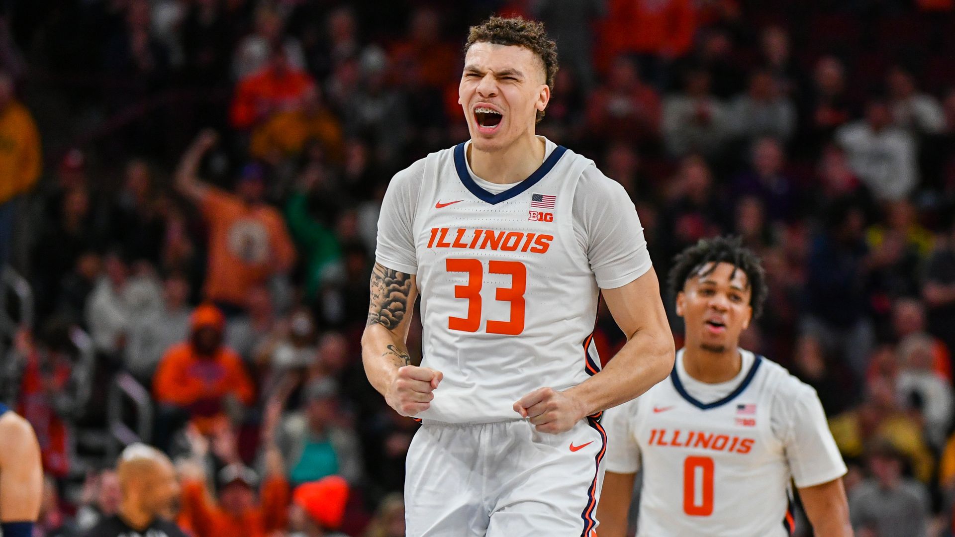 Photo of a basketball player celebrating on the court