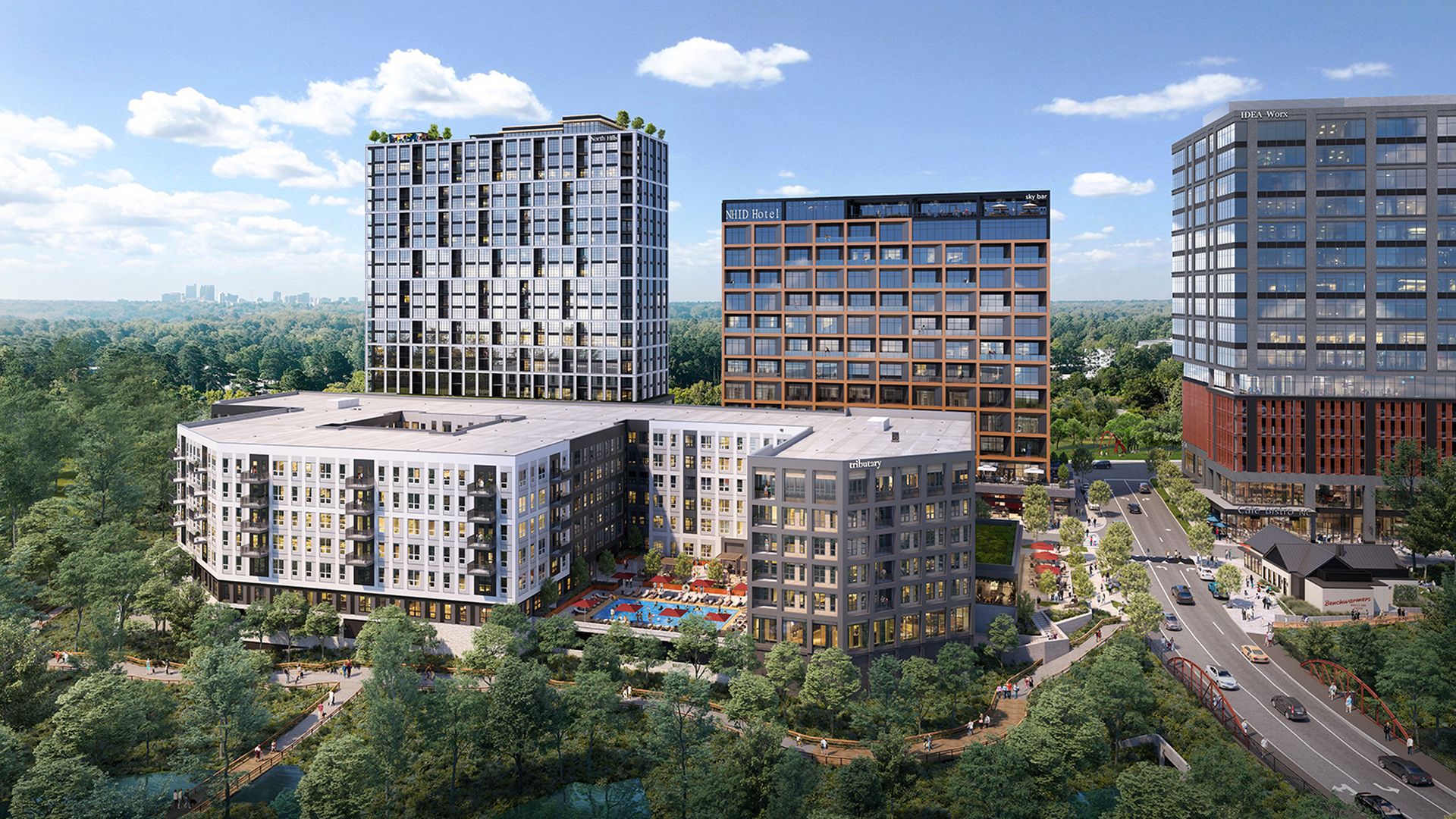 Modern urban complex with white curved residential block, several glass towers, rooftop greenery, and a central pool courtyard. Surrounded by woods, roads, and a sunny blue sky.