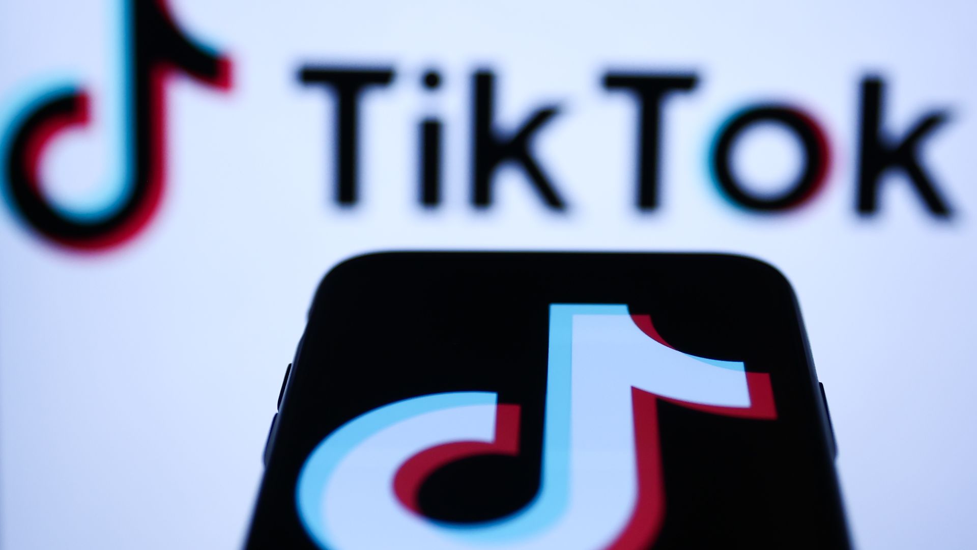 A phone displaying the logo of the TikTok app. 