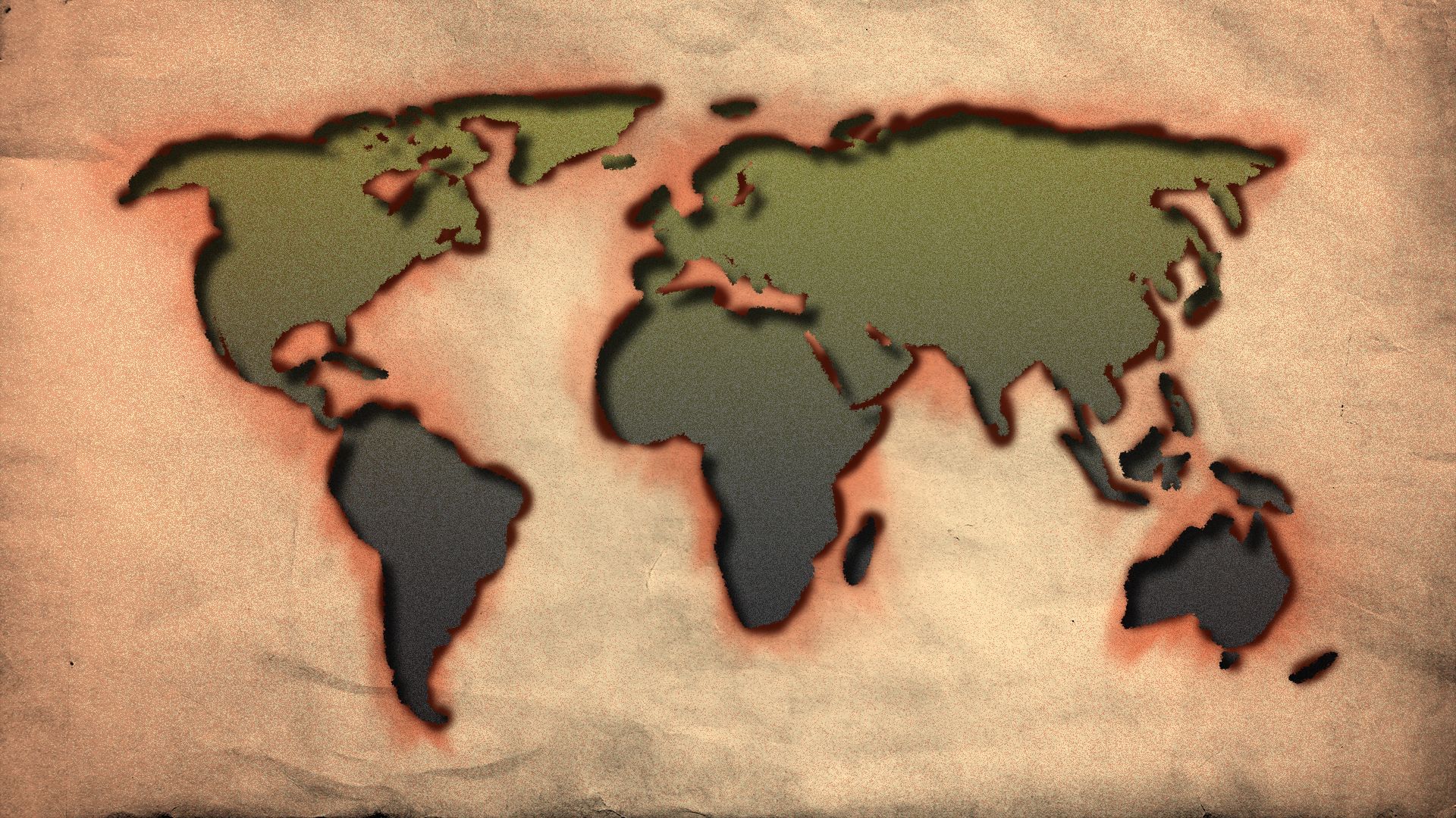 Illustration of the shapes of the world's continents burned out of a piece of paper. 