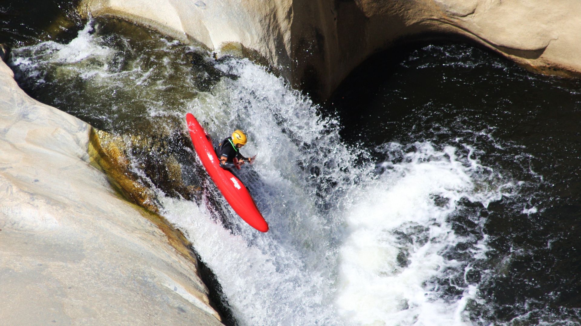 A kayaker plunges over one of the "Seven Teacups" of Dry Meadow Creek in California's Sequoia National Forest. Photo: Glen Maki, via U.S. Forest Service