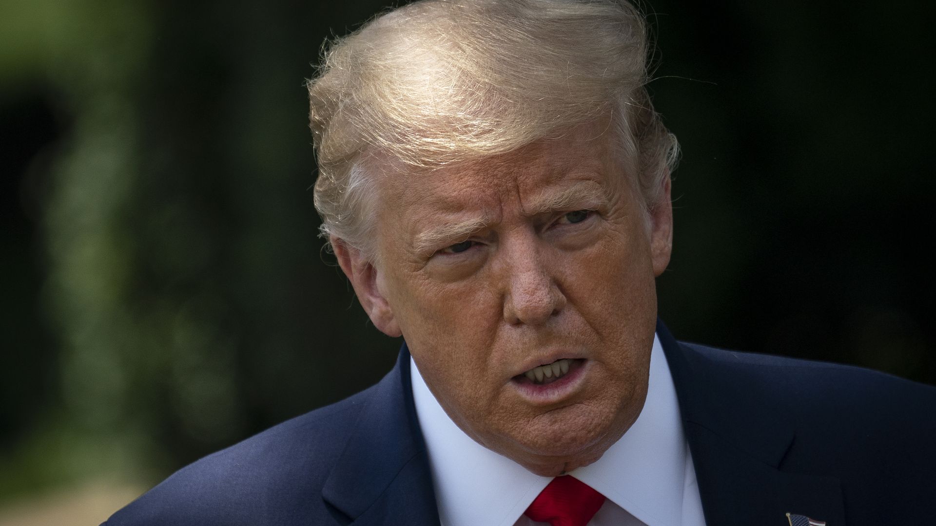 President Trump with a suit and red tie