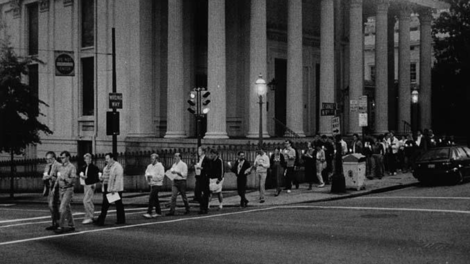 A black and white photo of people marching