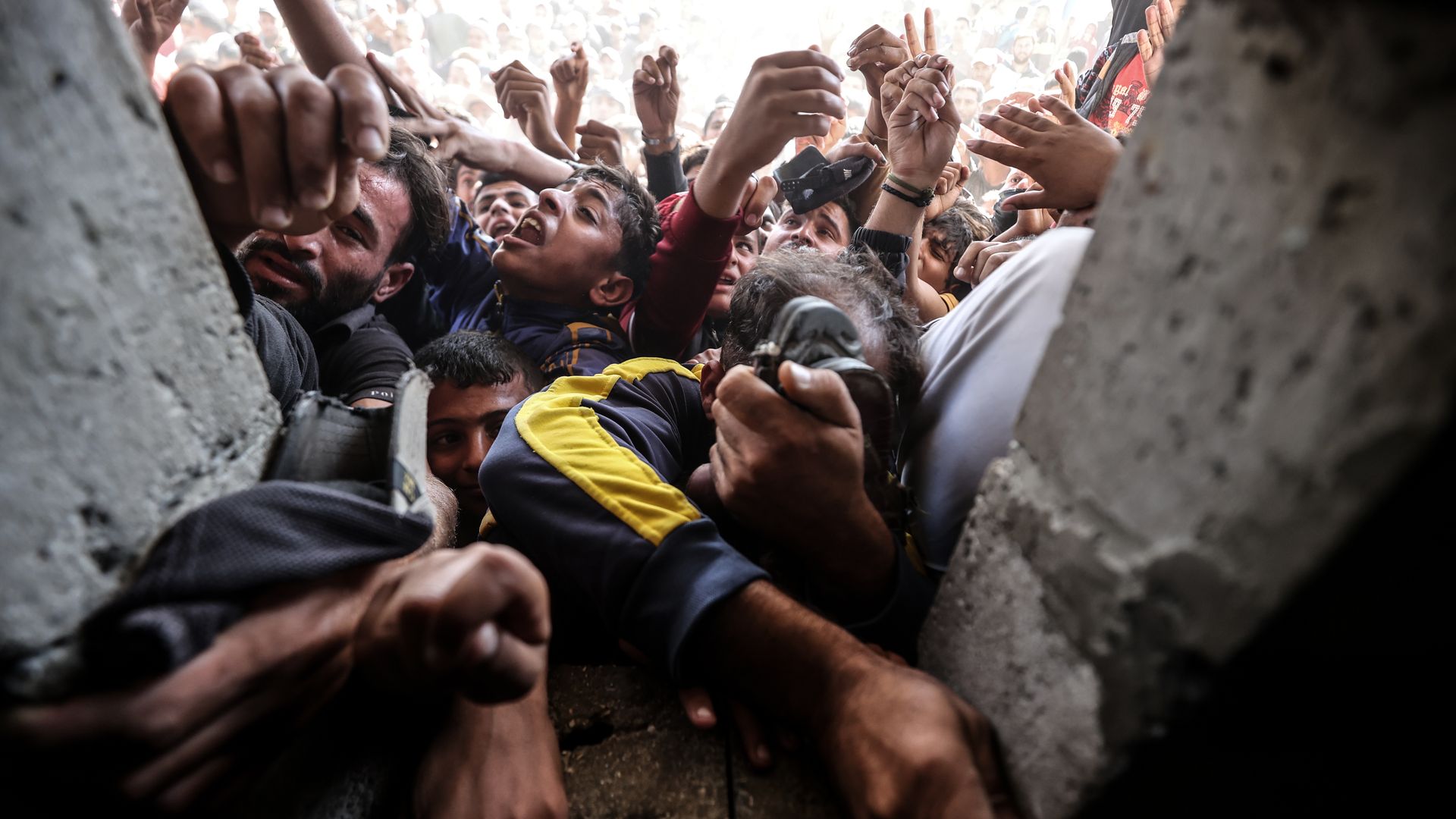 Palestinians wait in long queues to buy bread in front of the only bakery in Khan Yunis due to the Israeli decision to allow a limited amount of flour and fuel into Gaza on October 24, 2024. 