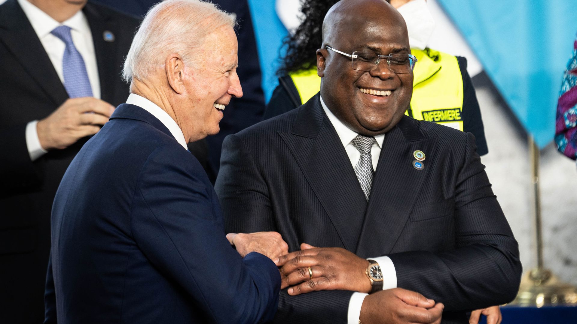 resident Joe Biden (L) and DR Congo President Felix Tshisekedi joke during a group photo at the G20 of World Leaders Summit on October 30, 2021