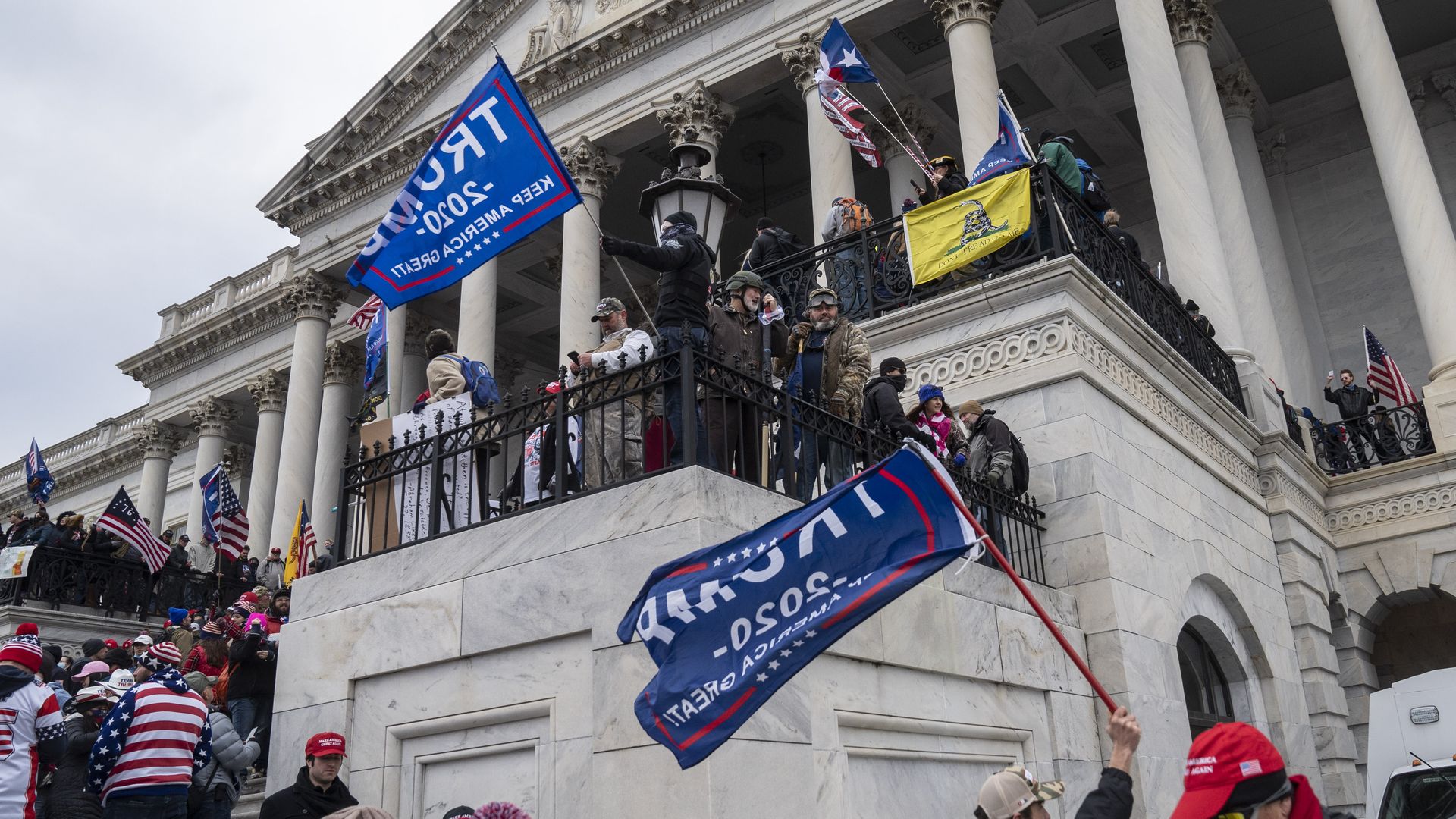 Supporters of then-President Trump are seen overtaking the steps of the U.S. Capitol on Jan. 6.