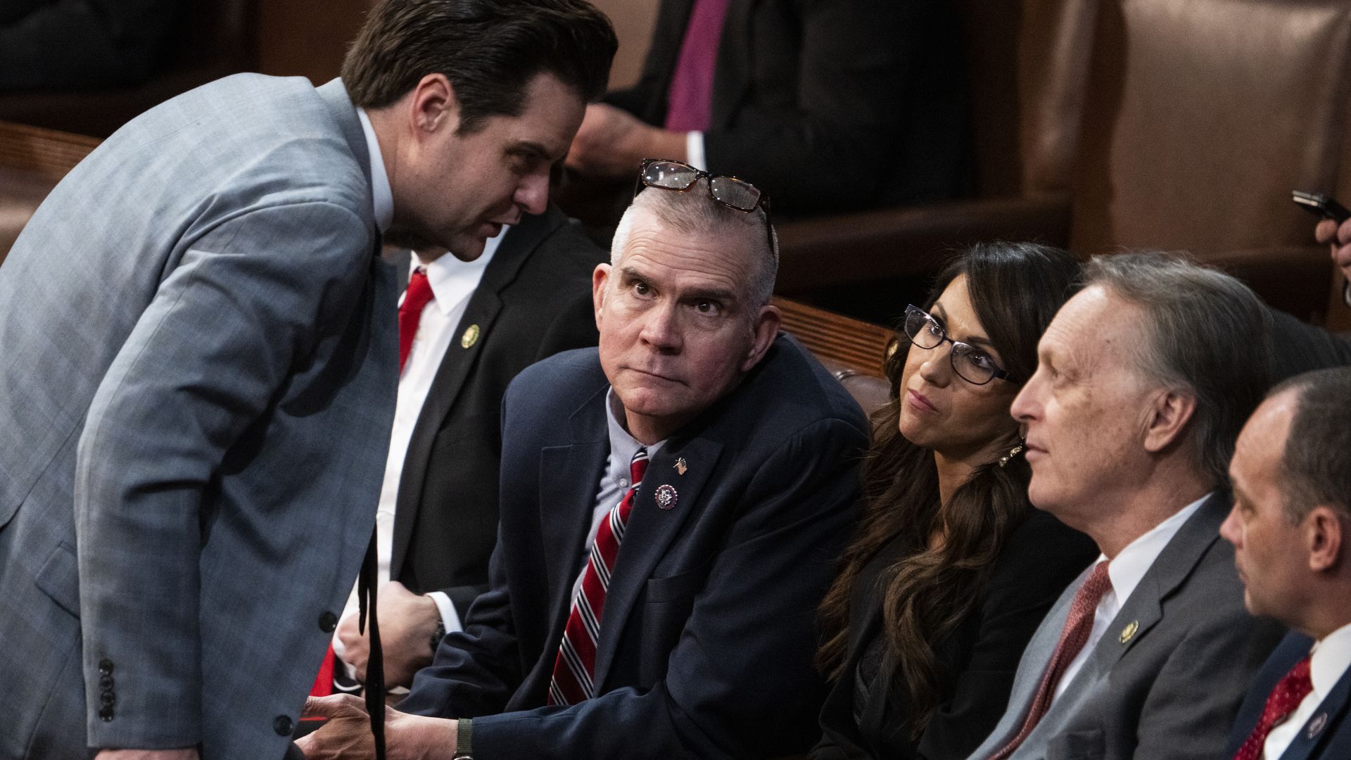 Members of Congress huddled. 