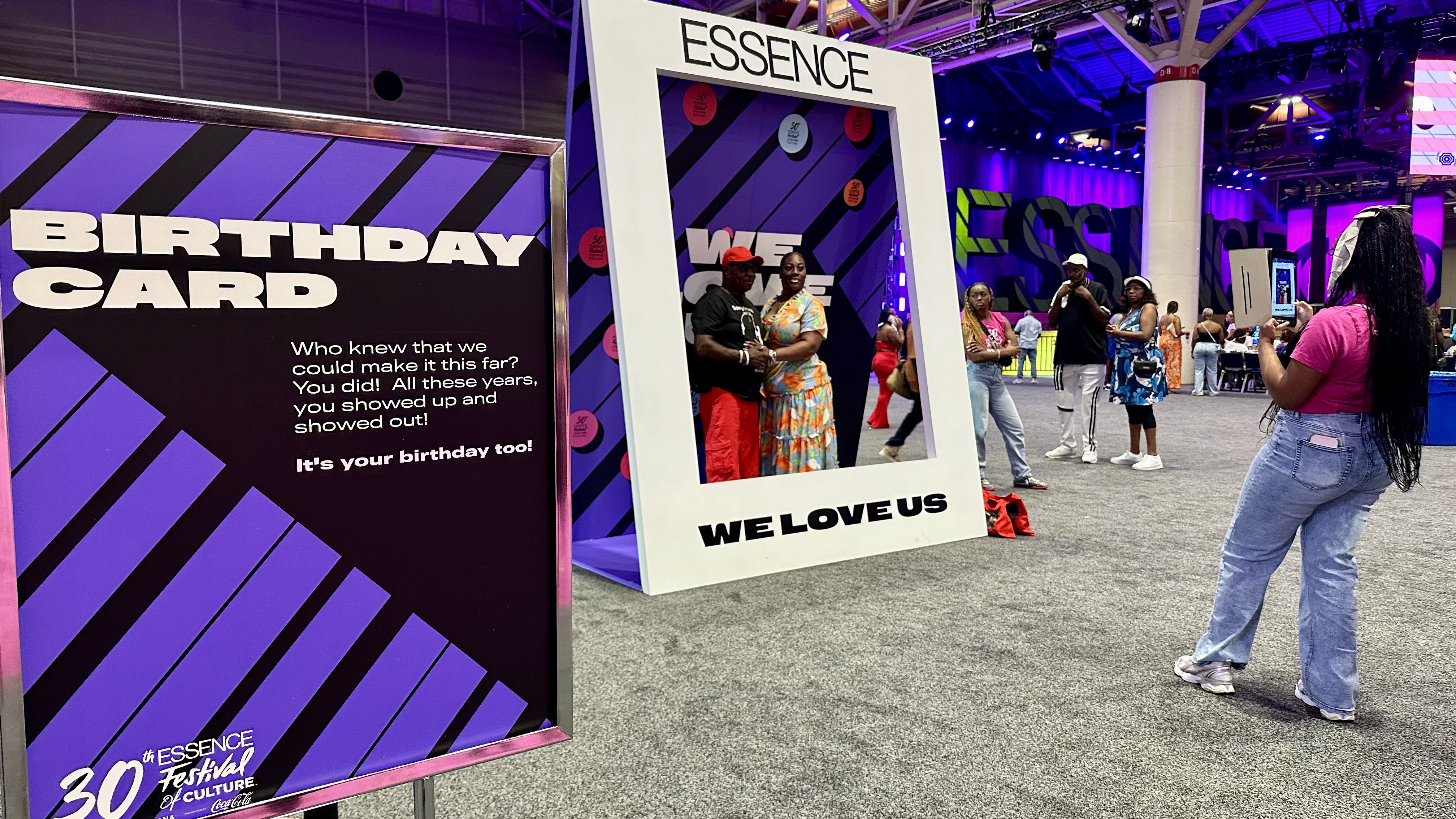 Photo shows people take a photo at Essence in a frame.