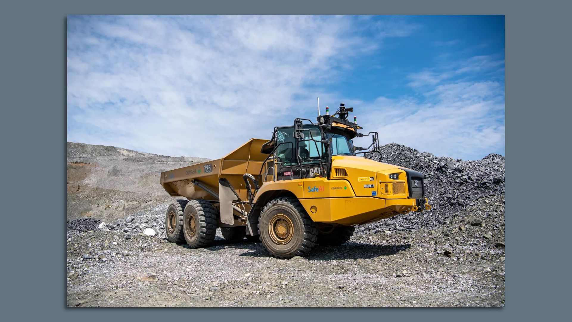 Photo of a heavy duty mining vehicle at an extraction site.