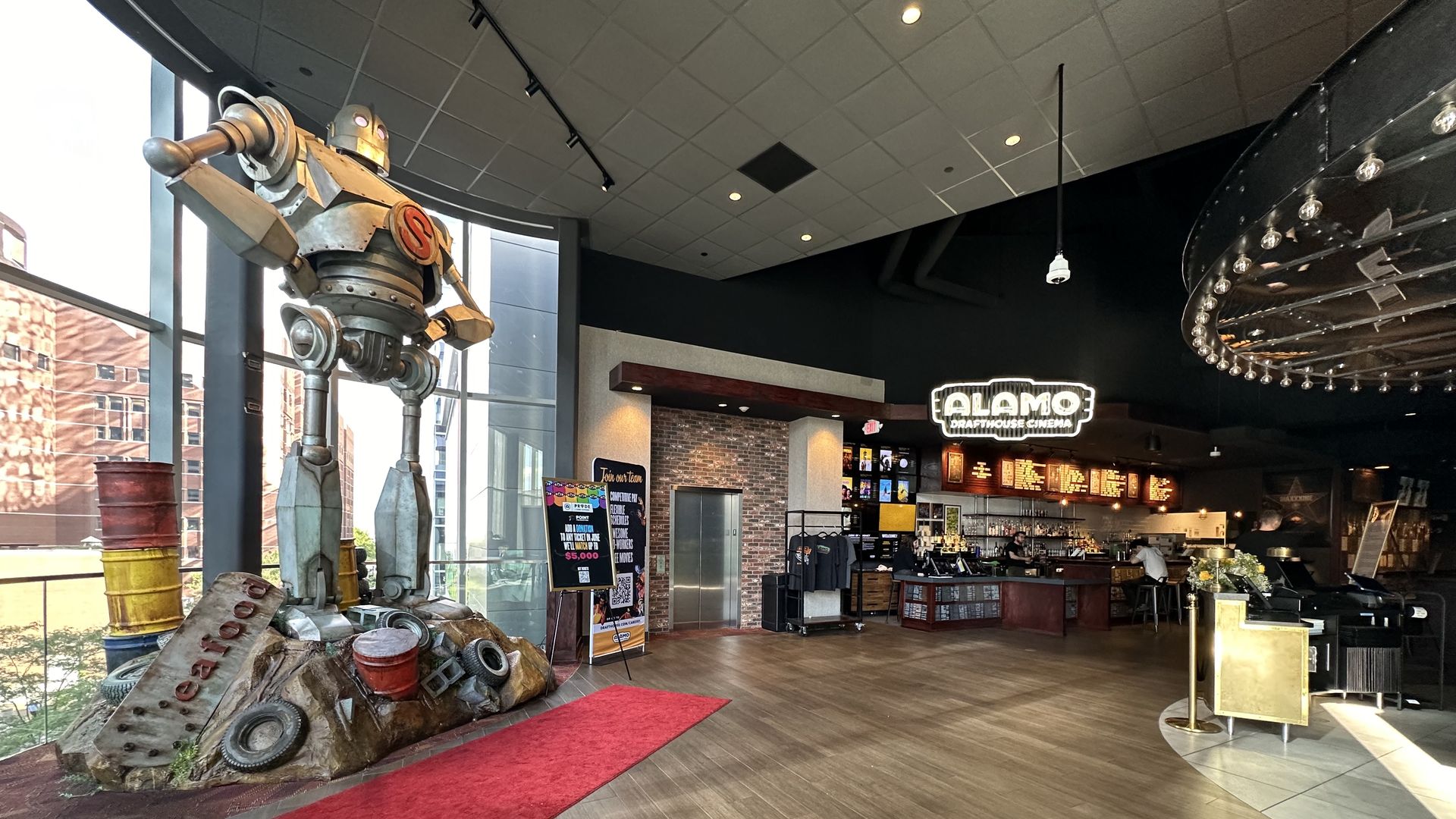 A replica of the Iron Giant stands at the entrance of the Alamo Drafthouse Cinema in Boston's Seaport neighborhood