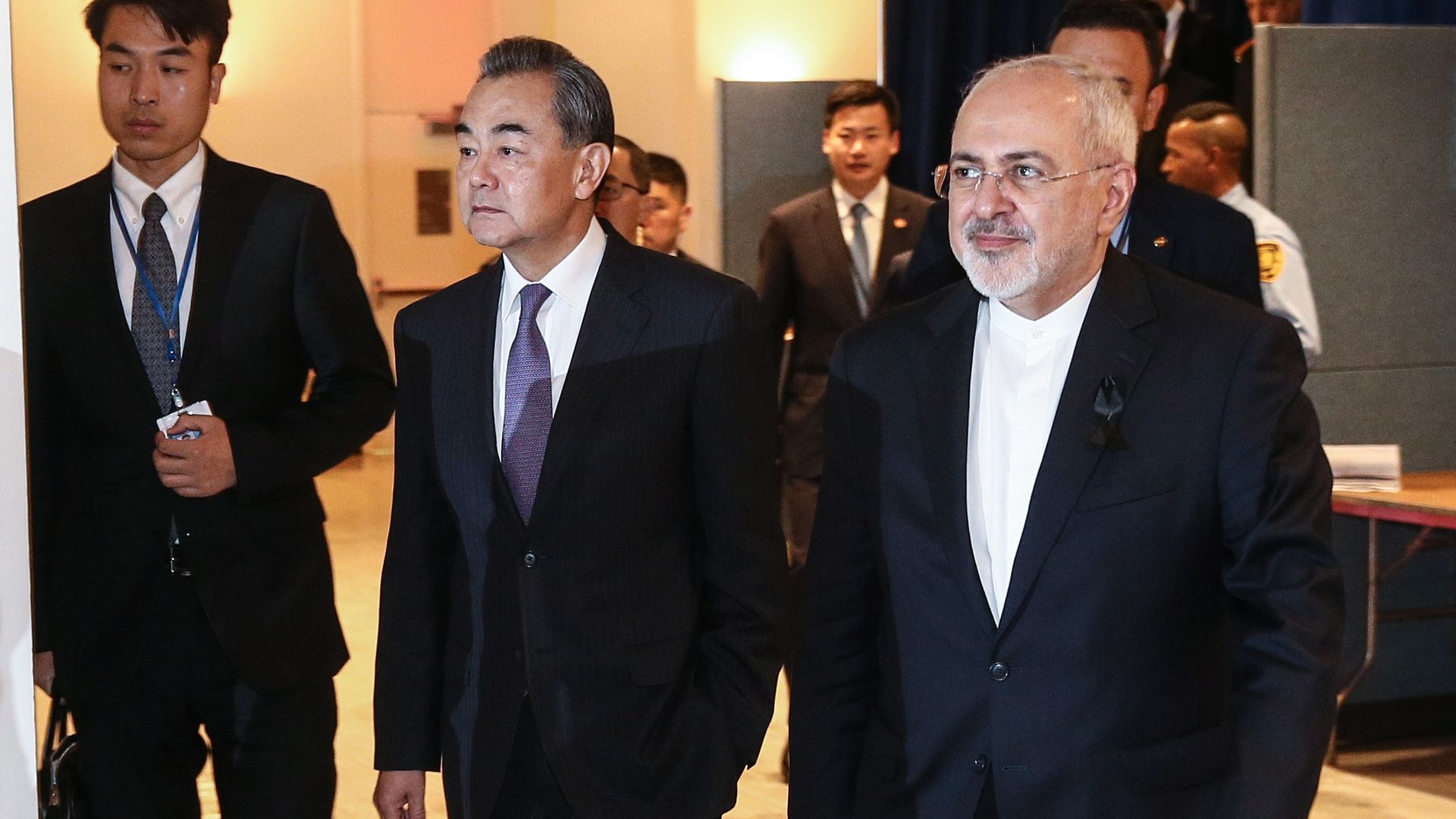China's Foreign Minister Wang Yi and Iran's Foreign Minister Mohammad Javad Zarif walking