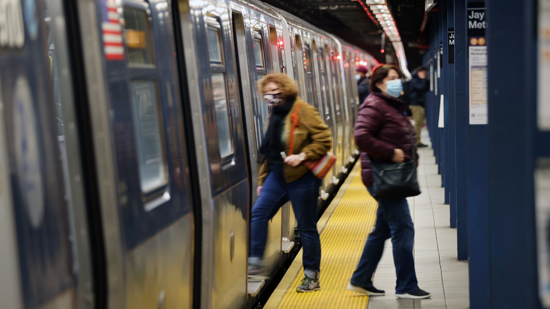 A person boarding a subway.