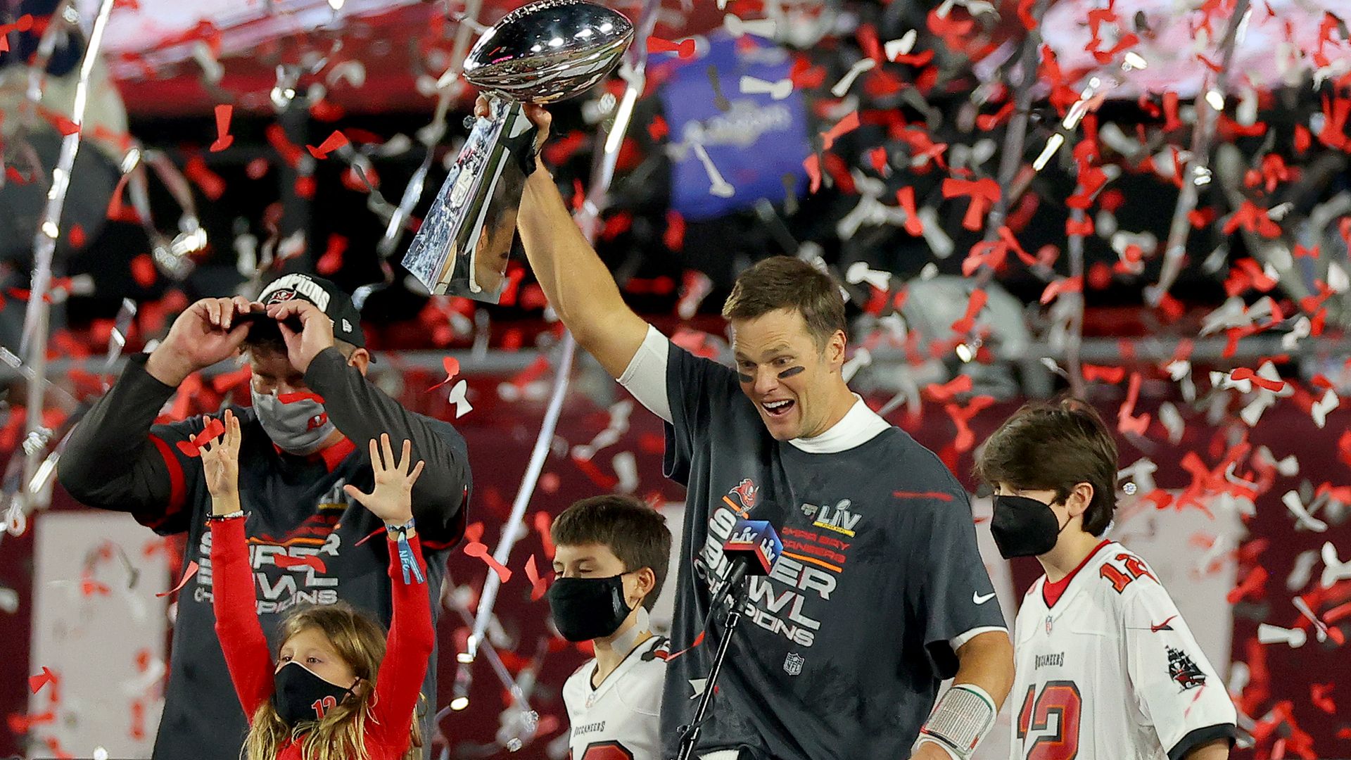  Tom Brady #12 of the Tampa Bay Buccaneers celebrates with the Lombardi Trophy after defeating the Kansas City Chiefs in Super Bowl LV at Raymond James Stadium on February 07, 2021 in Tampa, Florida. 
