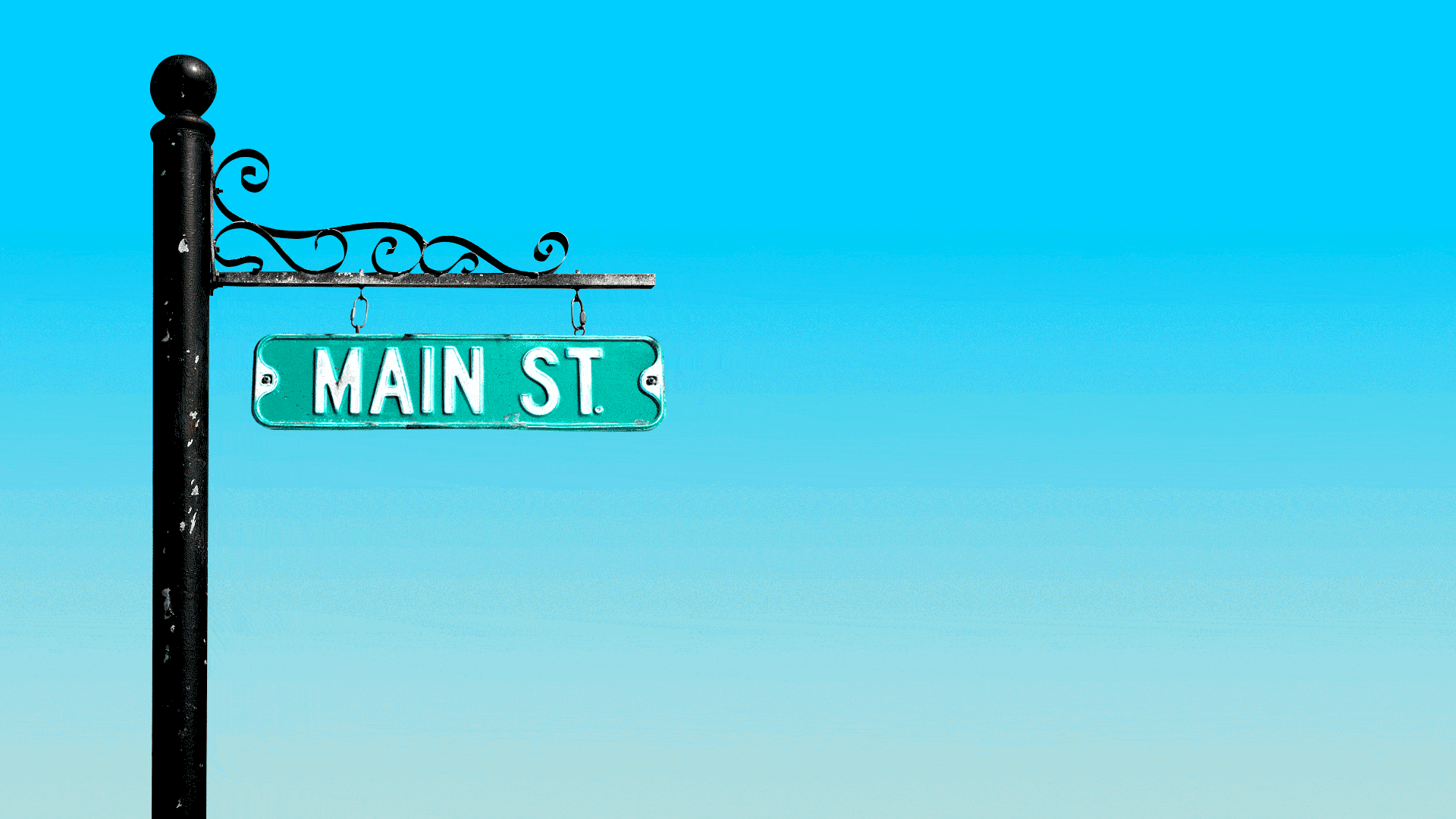 Illustration of a hanging sign that reads "Main St." swinging and hanging from one chain