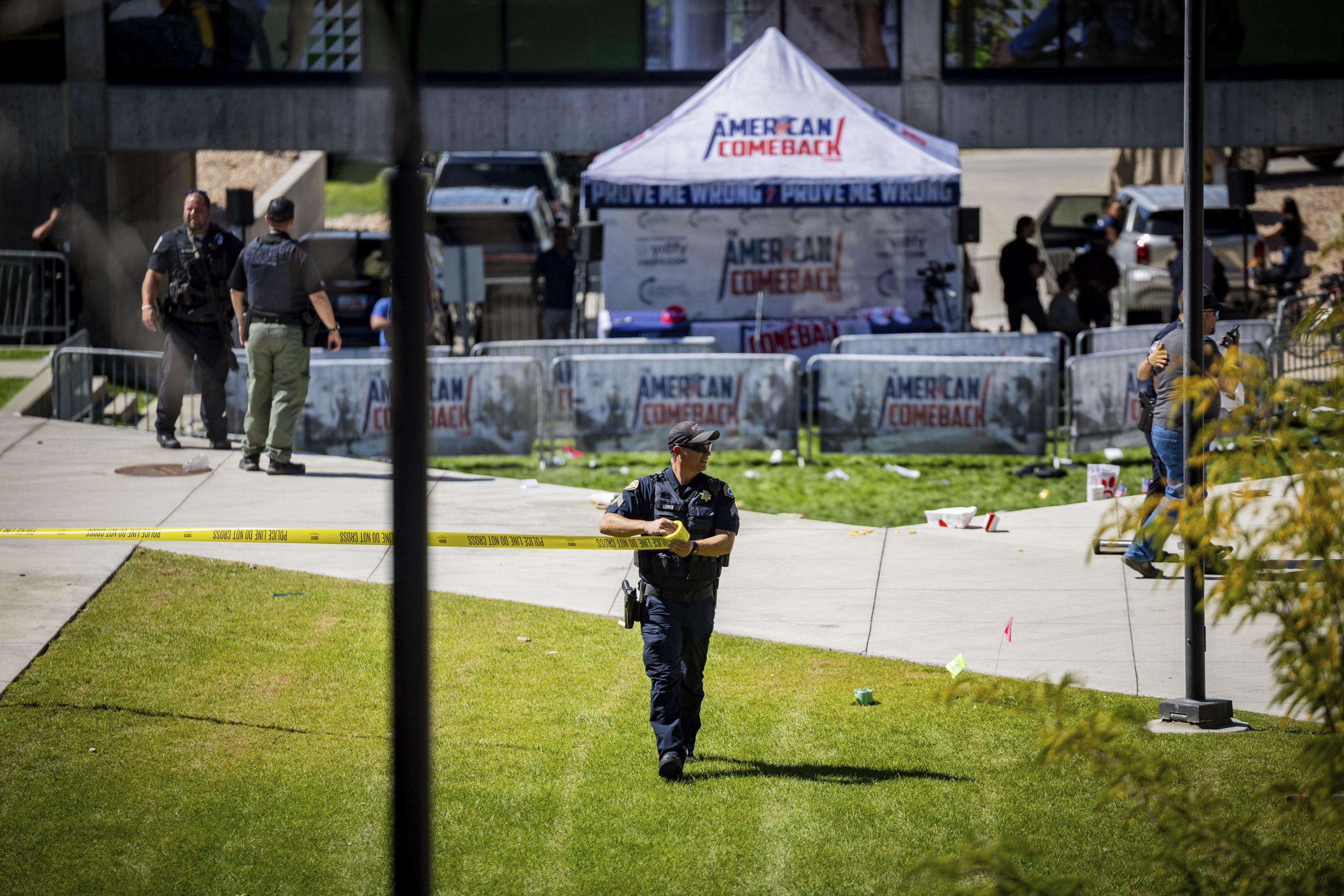 Law enforcement tapes off an area after Charlie Kirk was killed at Utah Valley University yesterday. 