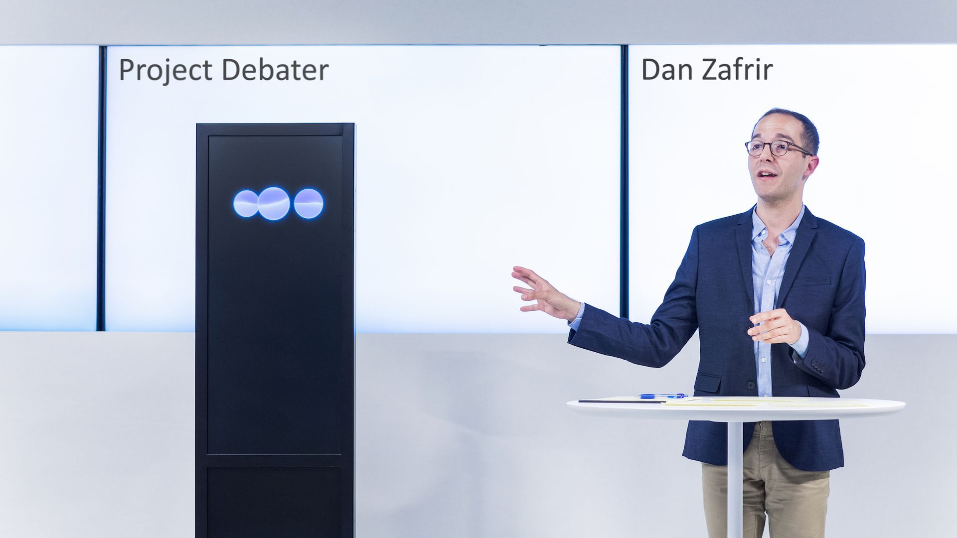 Human debater with box representing artificial intelligence debater