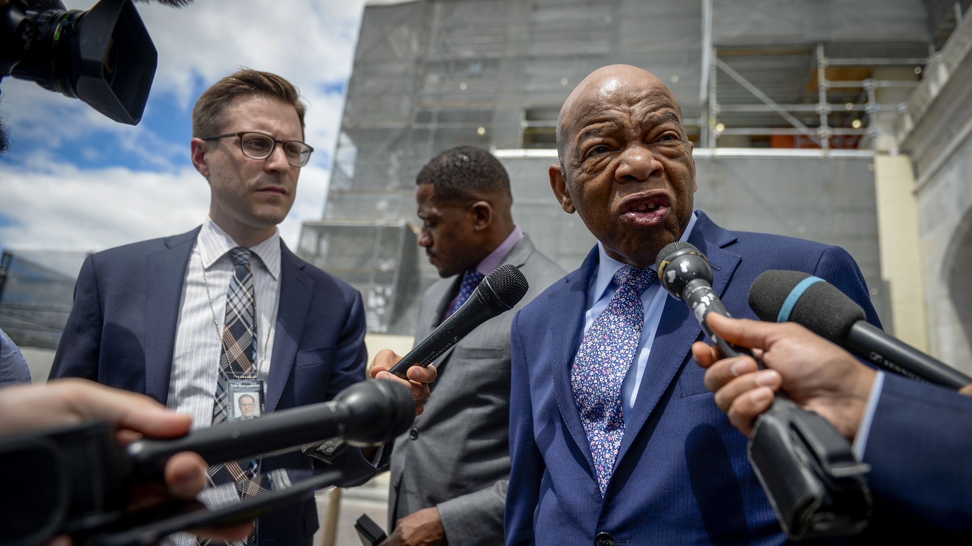 Rep. John Lewis being interviewed by reporters outside of the Capitol building