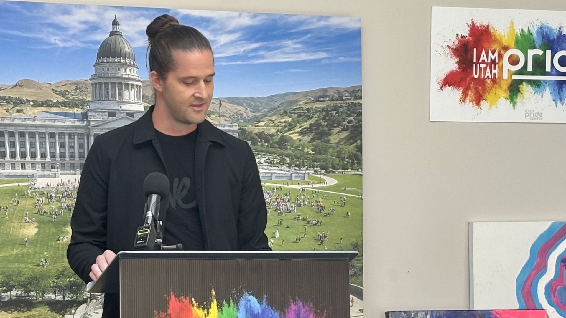 Chad Call speaks at a podium.