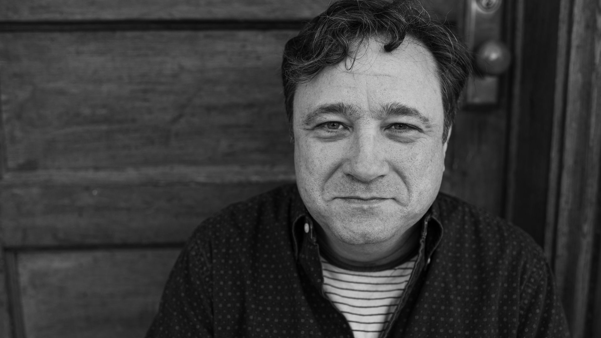 Photo of a man smiling for the camera