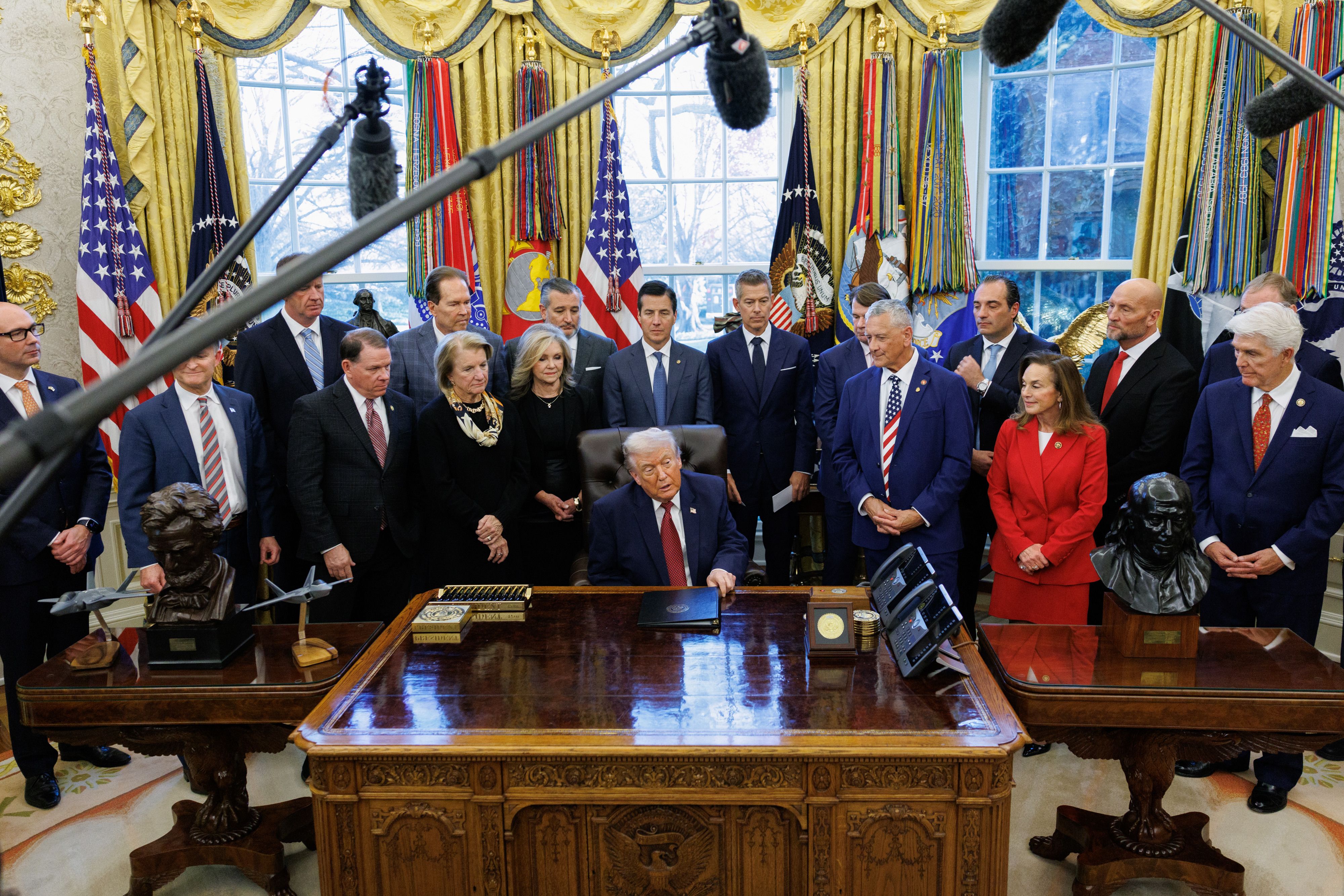 President Trump announces lower fuel efficiency standards for cars in the Oval Office yesterday.