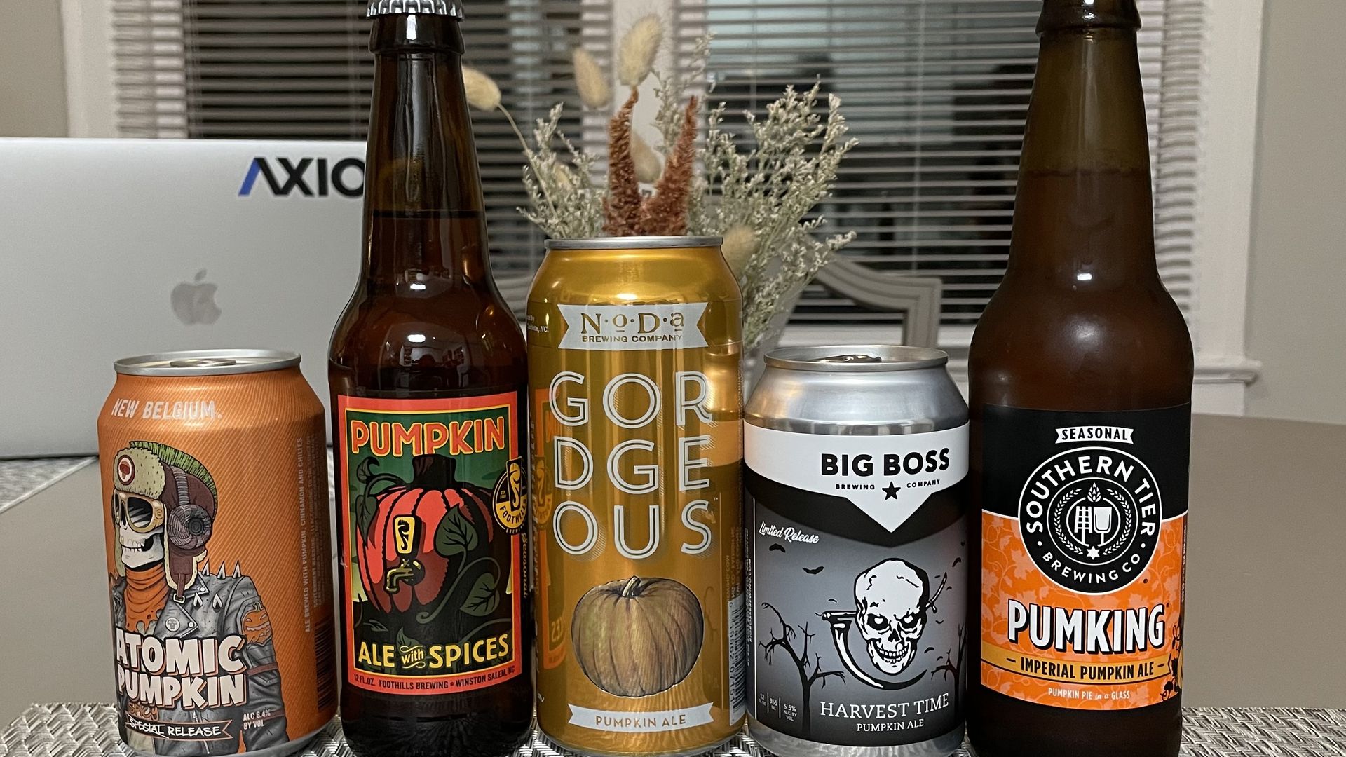 A row of pumpkin ales on a table. 