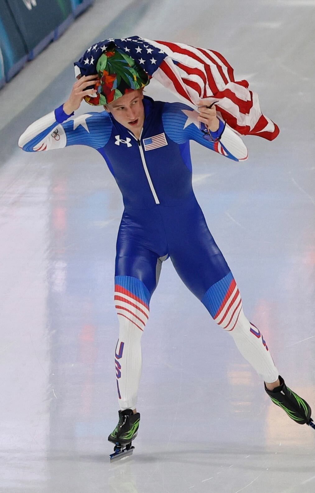 Jordan Stolz won gold in the 1000 speed skating, with Snoop Dogg sitting just a couple rows in front of me. I didn't get to interview Snoop, but I did give him an Axios pin and got one of his. That's Stolz in his Olympic record setting win, then celebrating with an American flag. Then skating past s
