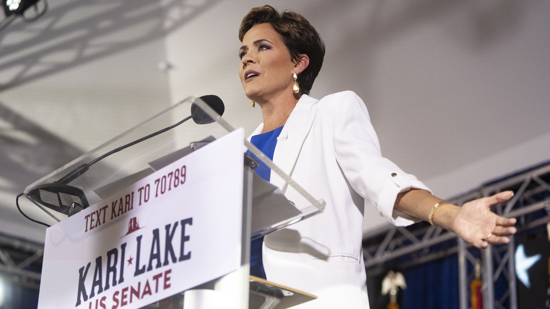 Kari Lake at a podium.