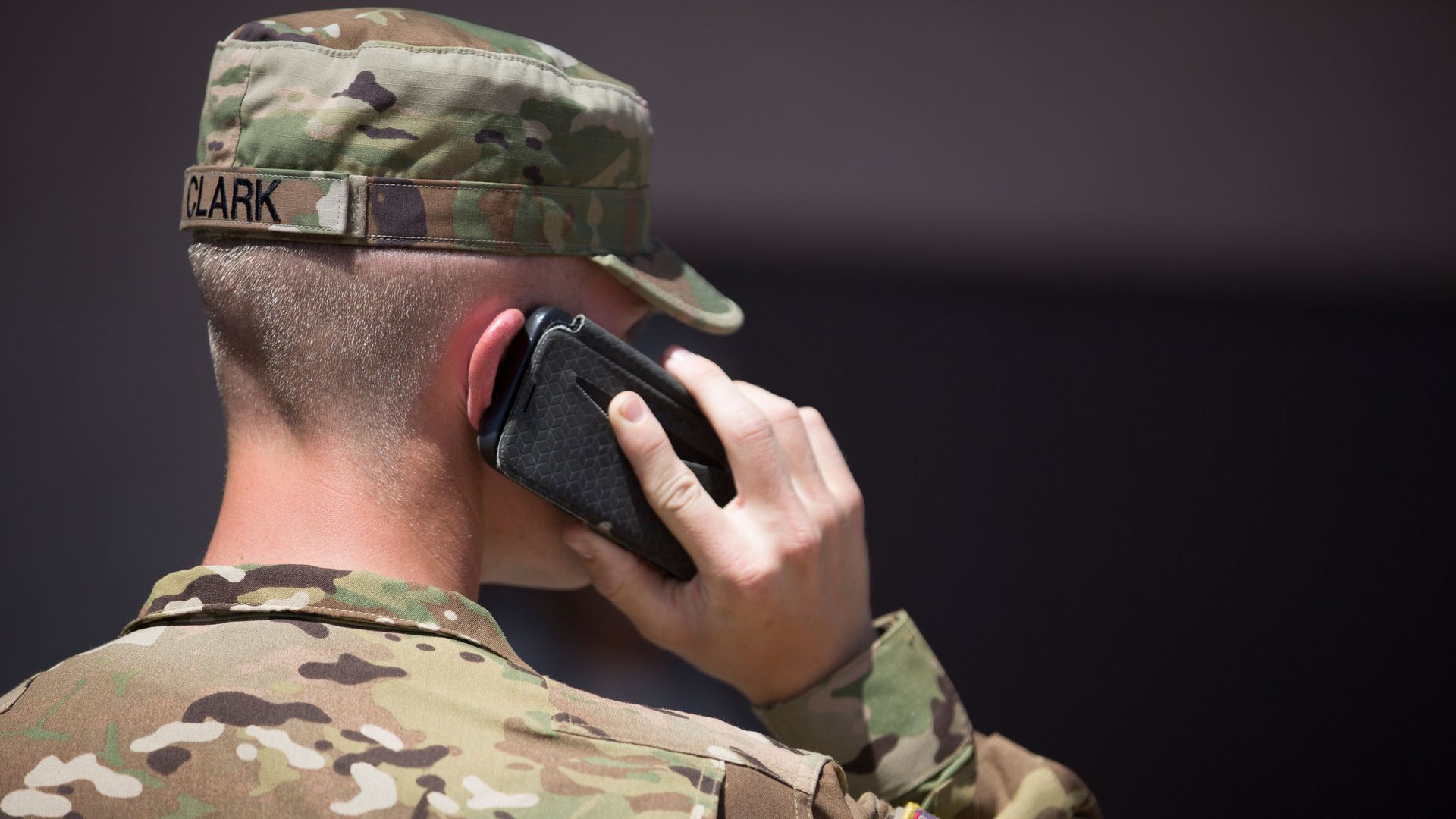 National Guard soldier talks into a phone