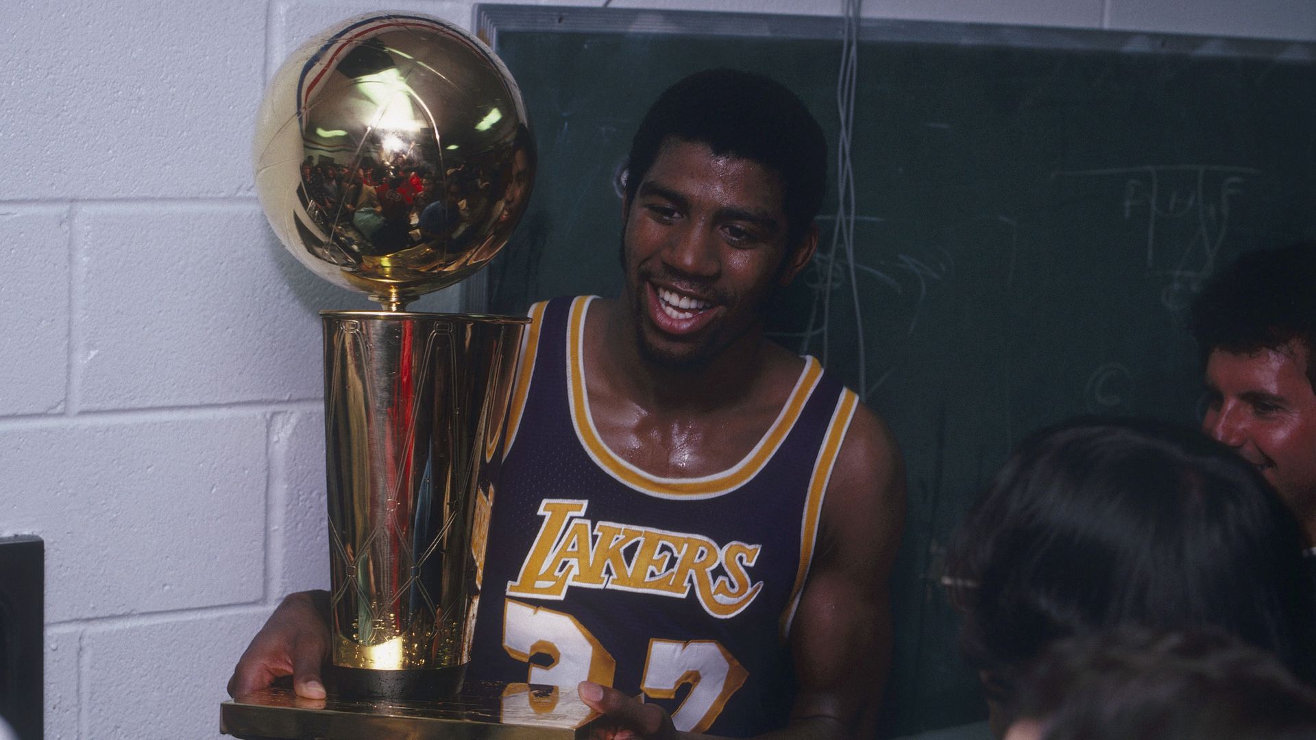 Magic Johnson celebrating in the Lakers' locker room