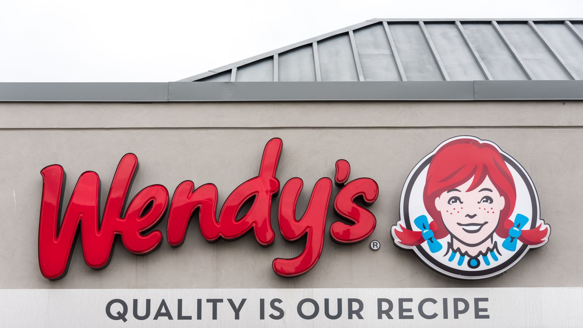 A Wendy's restaurant sign reading "Quality is our recipe."