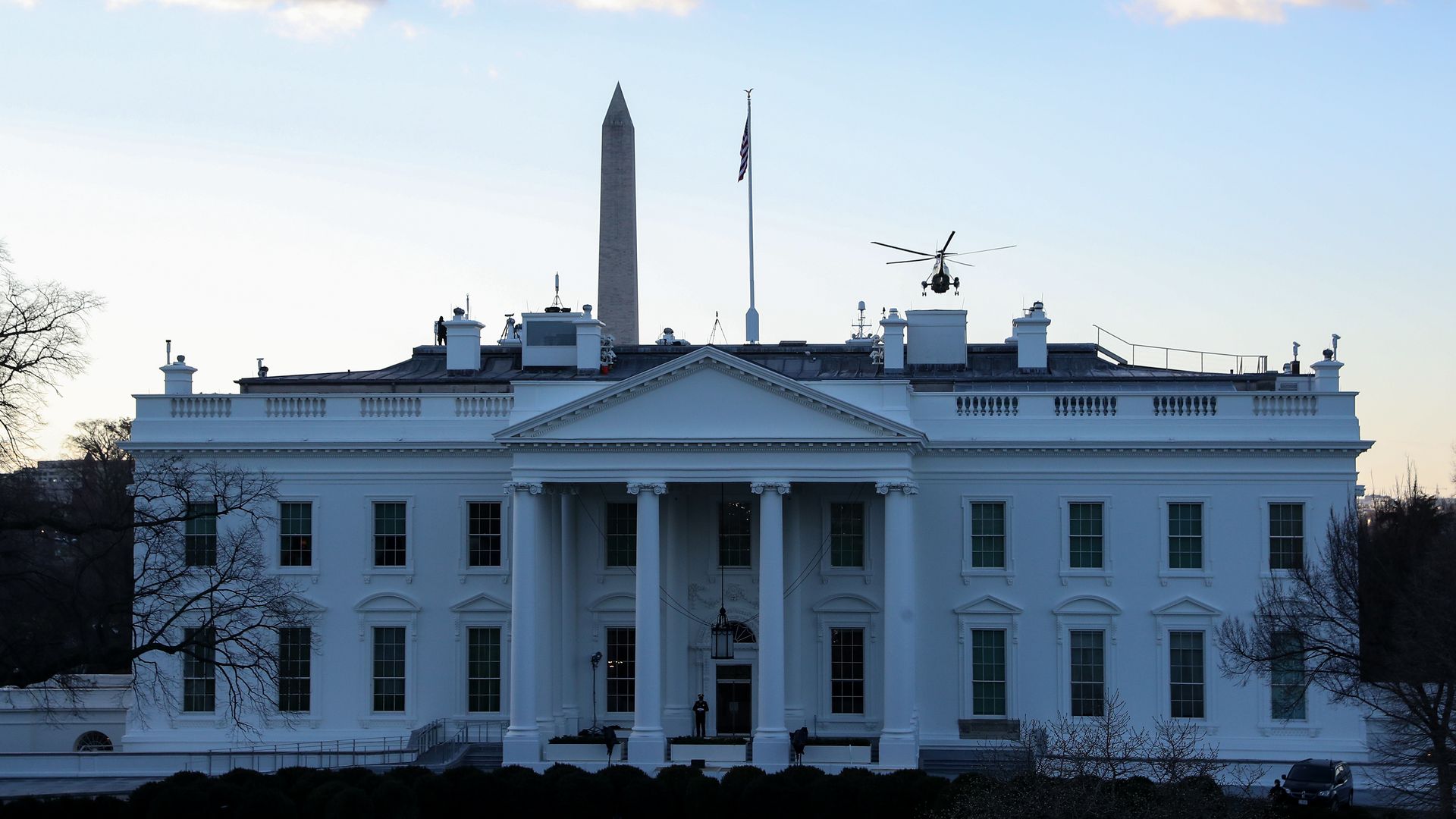 A Marine helicopter carrying President Trump is seem flying away from the White House on Inauguration Day.
