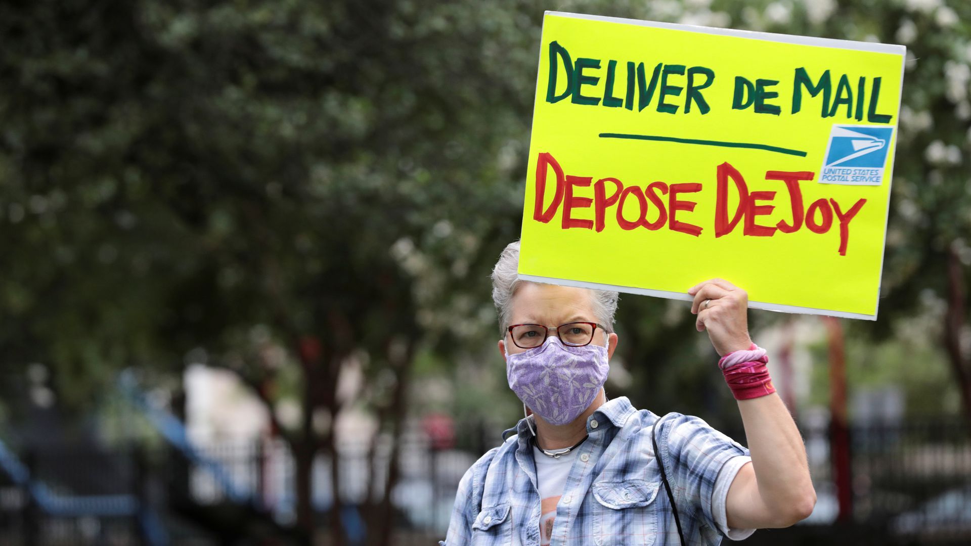 Protesters gather in Kalorama Park in D.C. today before demonstrating outside the condo of Postmaster General Louis DeJoy.