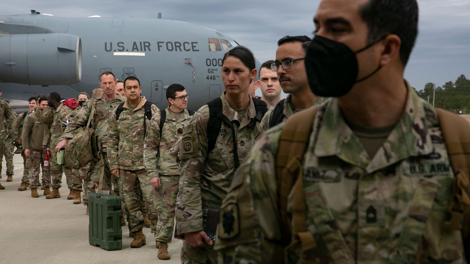 U.S. troops are seen Thursday deploying to Europe.
