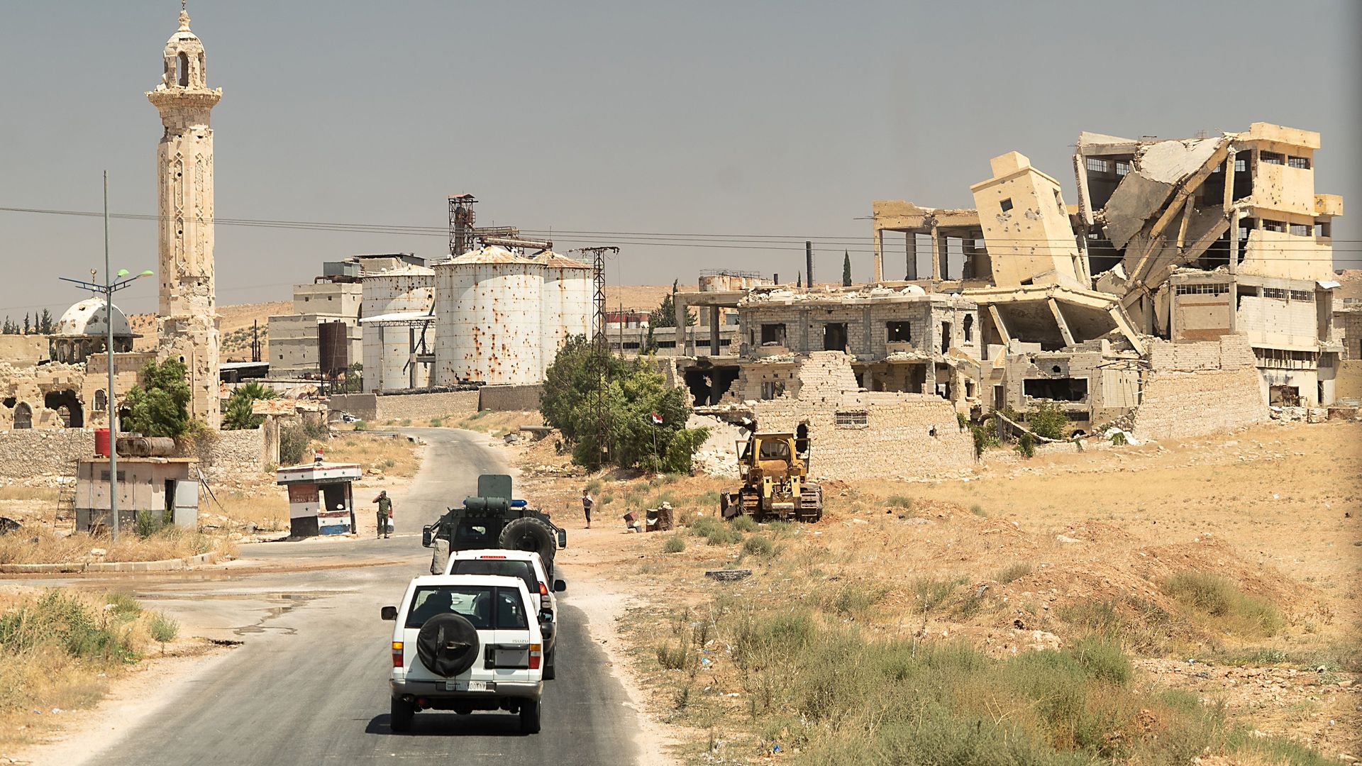 his picture taken on August 16, 2018 during a guided tour by the Russian Forces in Syria, shows a Russian army convoy driving in the East end of Aleppos industrial zone.