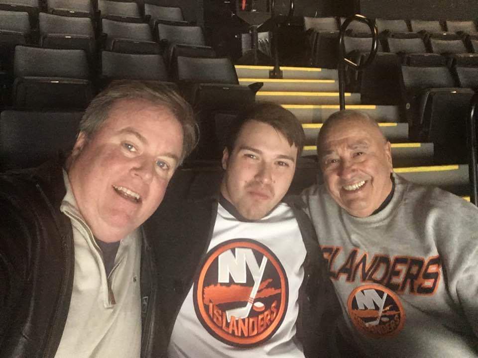 three generations watching hockey game together