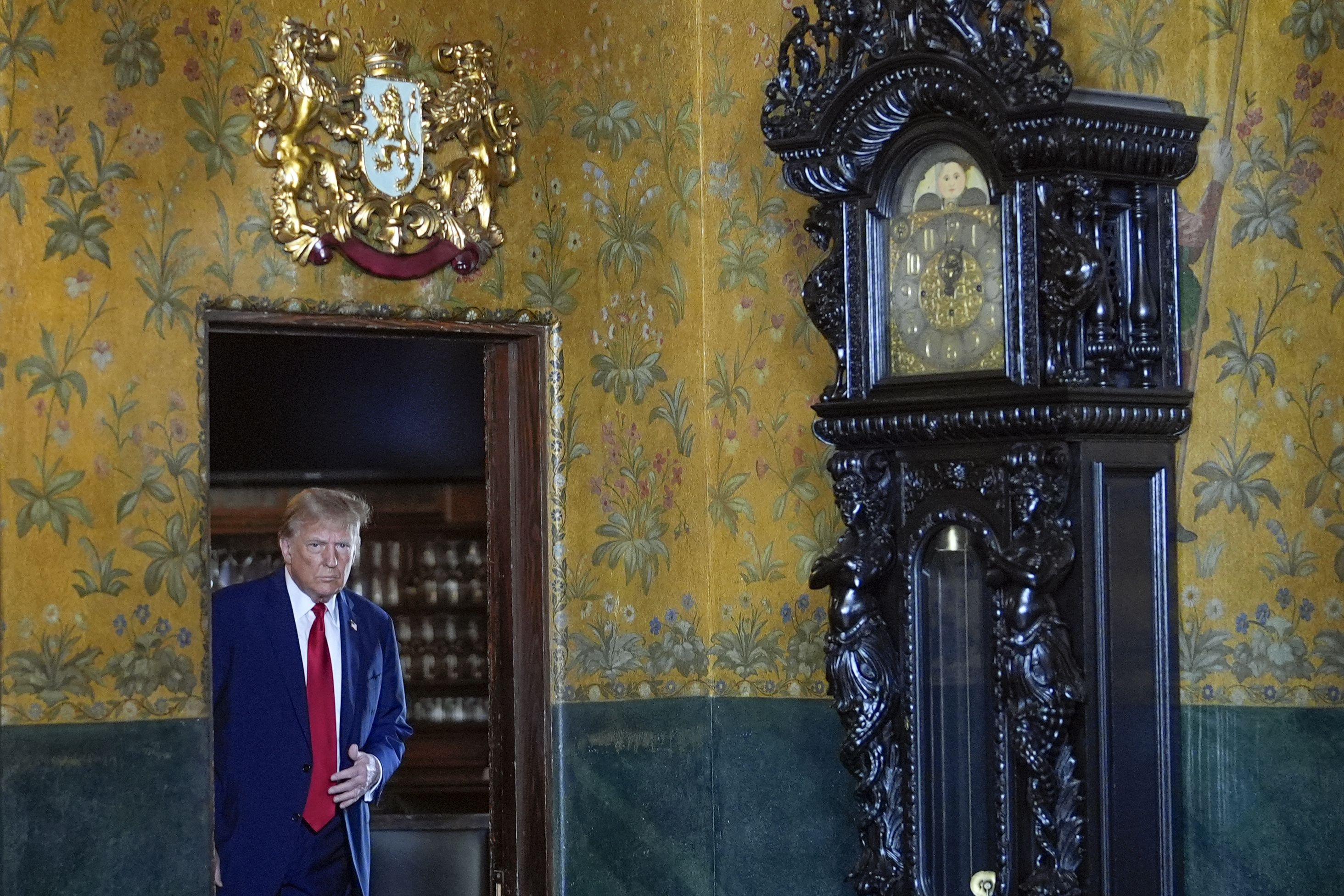 Former President Trump arrives to speak with reporters at Mar-a-Lago yesterday. 